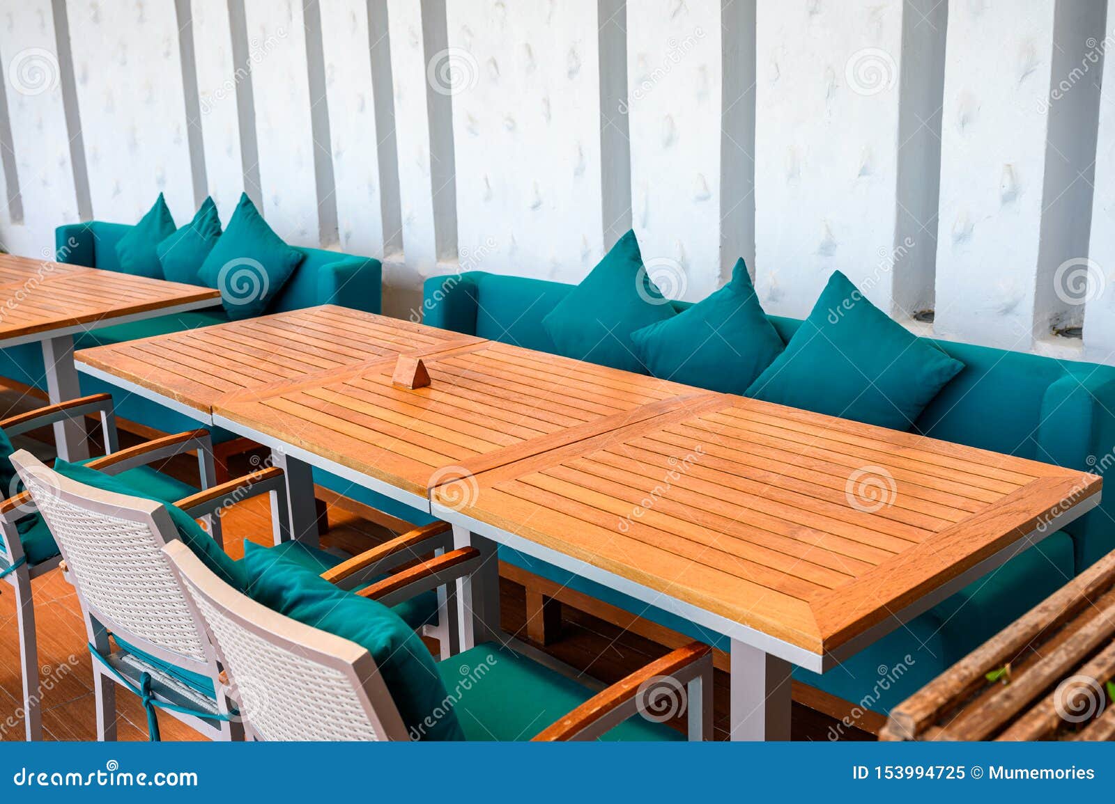 Wooden Dining Table with Green Pillows on Sofa Stock Image Image of contemporary, asia 153994725