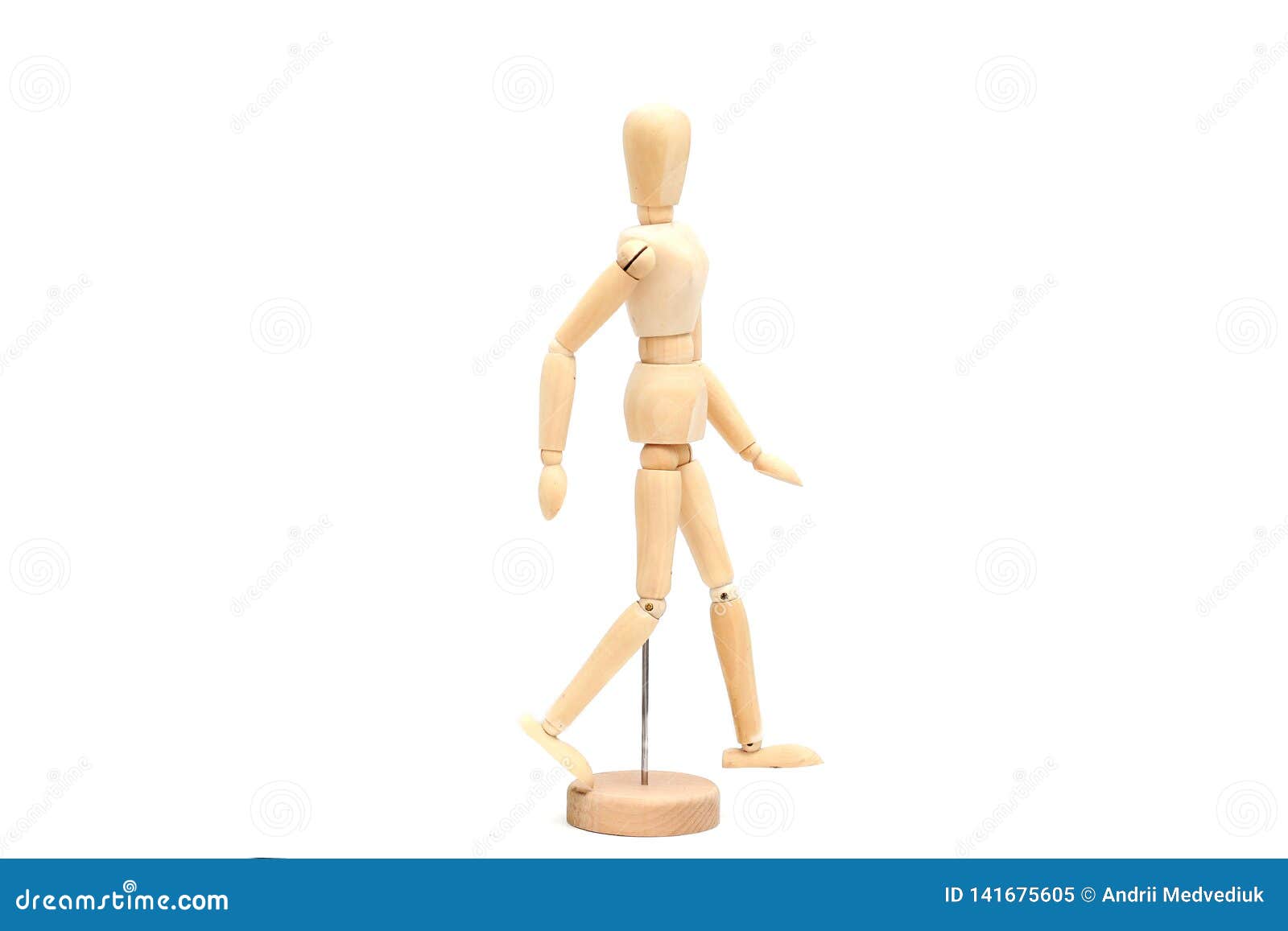 Vertical closeup shot of a wooden pose doll with one hand over its head and  the other on its waist Stock Photo - Alamy