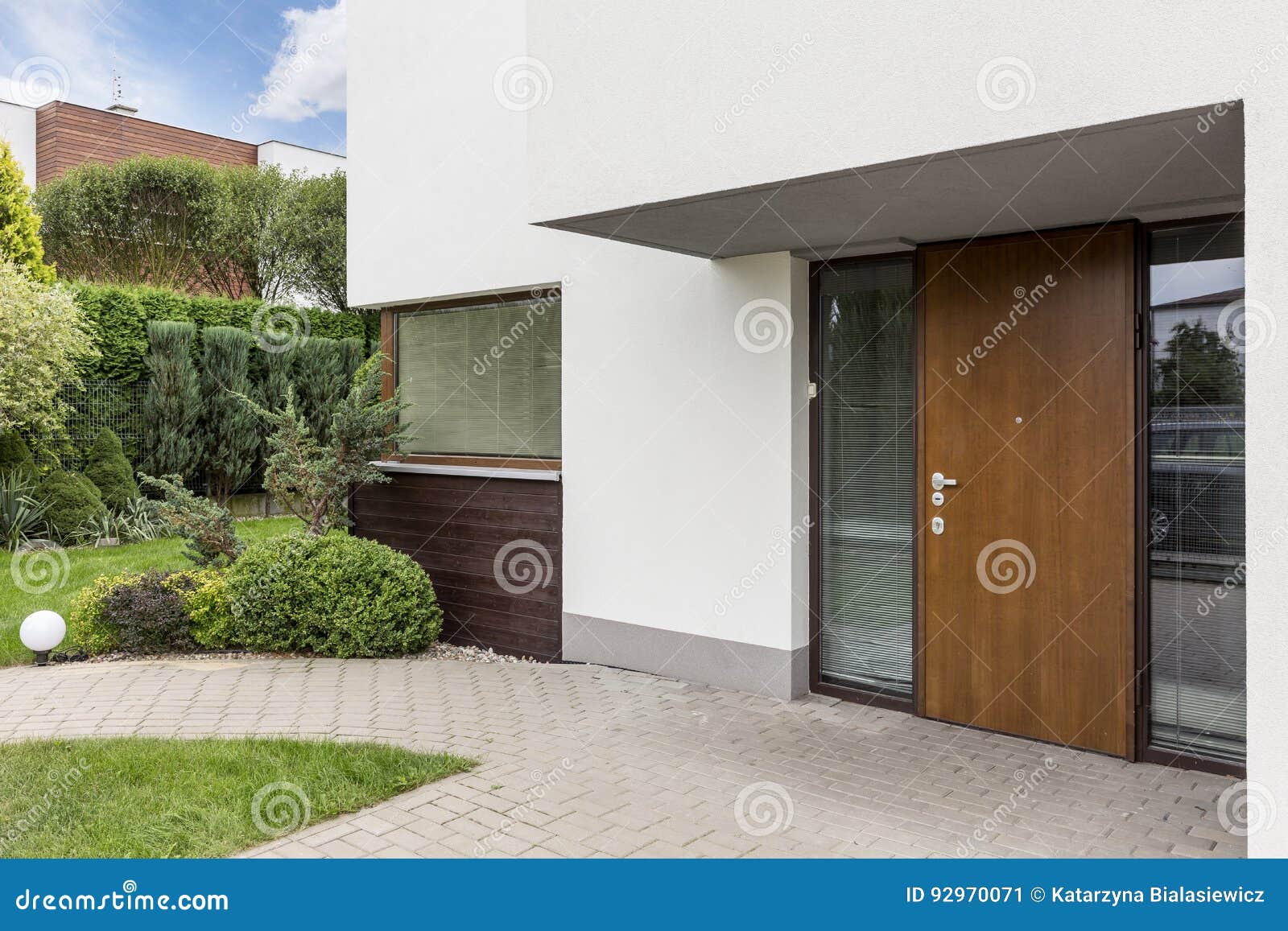 wooden entrance door to modern house