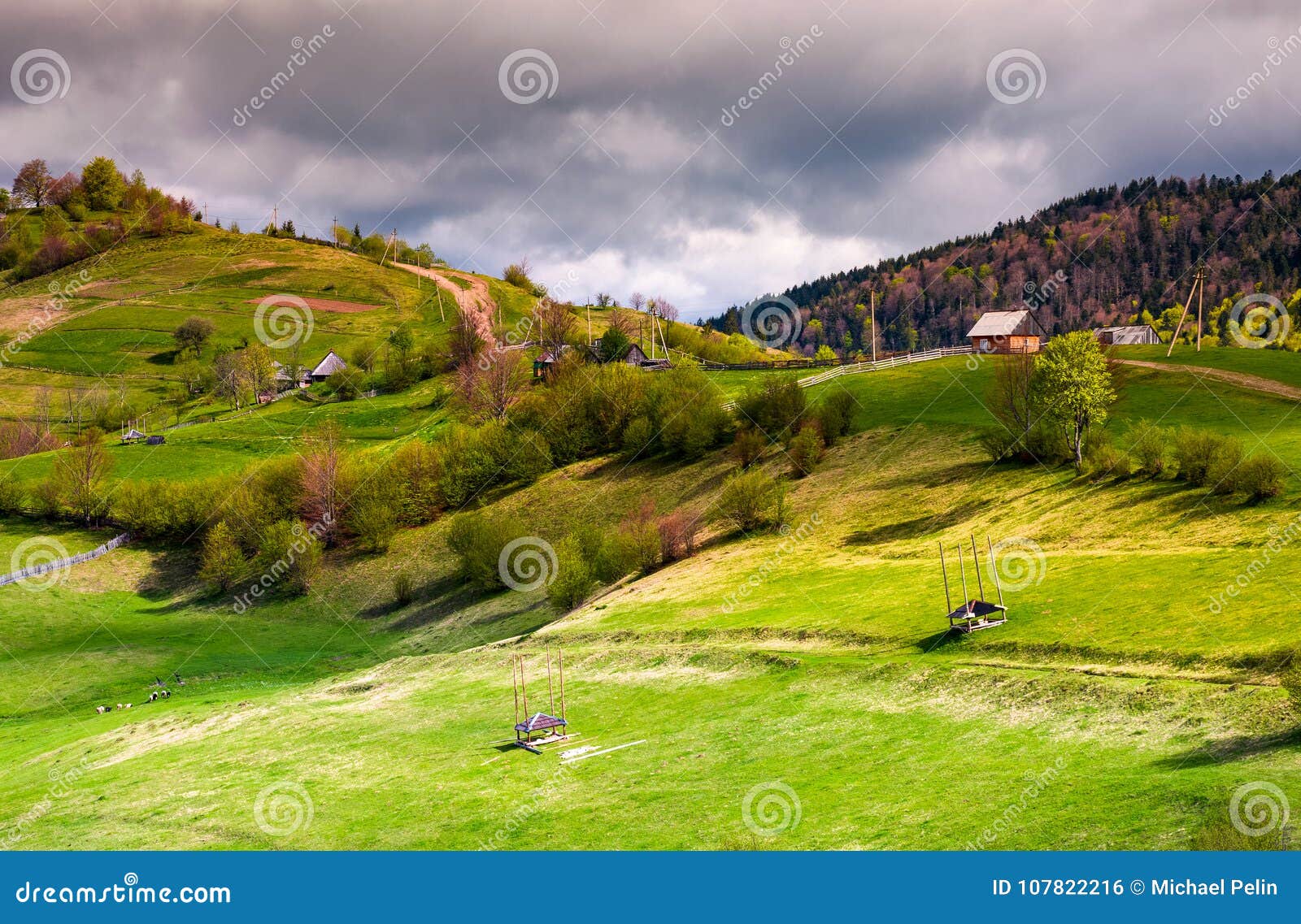 wooden fences of rural area on grassy hillsides