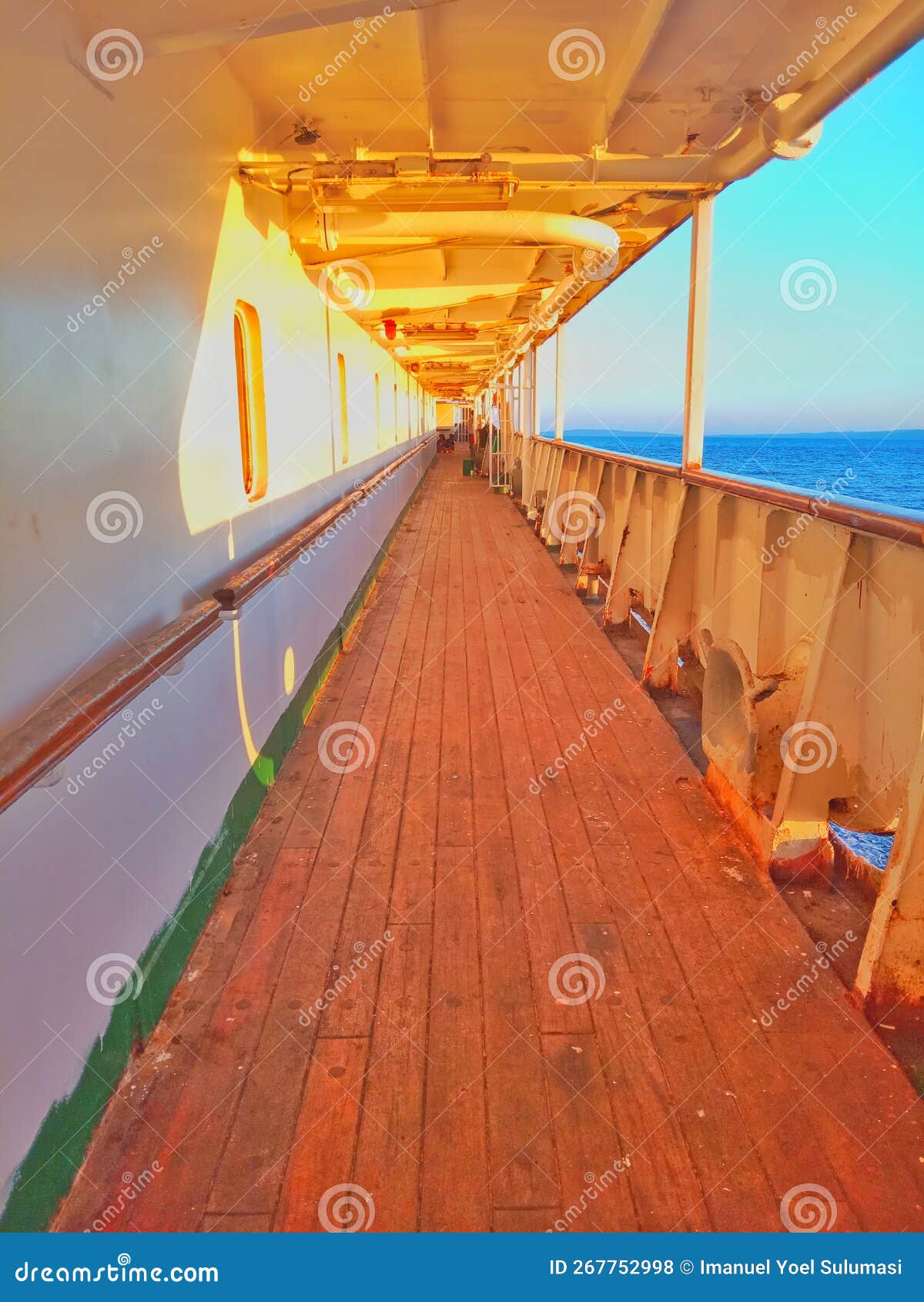a wooden-floored passageway on a passenger ship sailing at sea