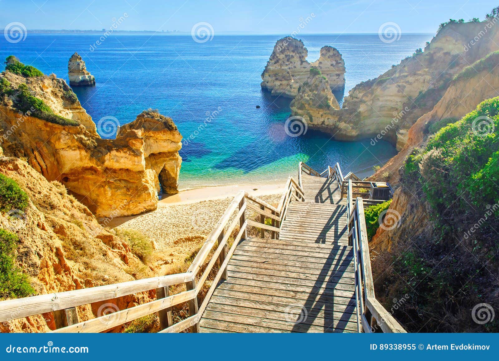 wooden footbridge to beautiful beach praia do camilo near lagos
