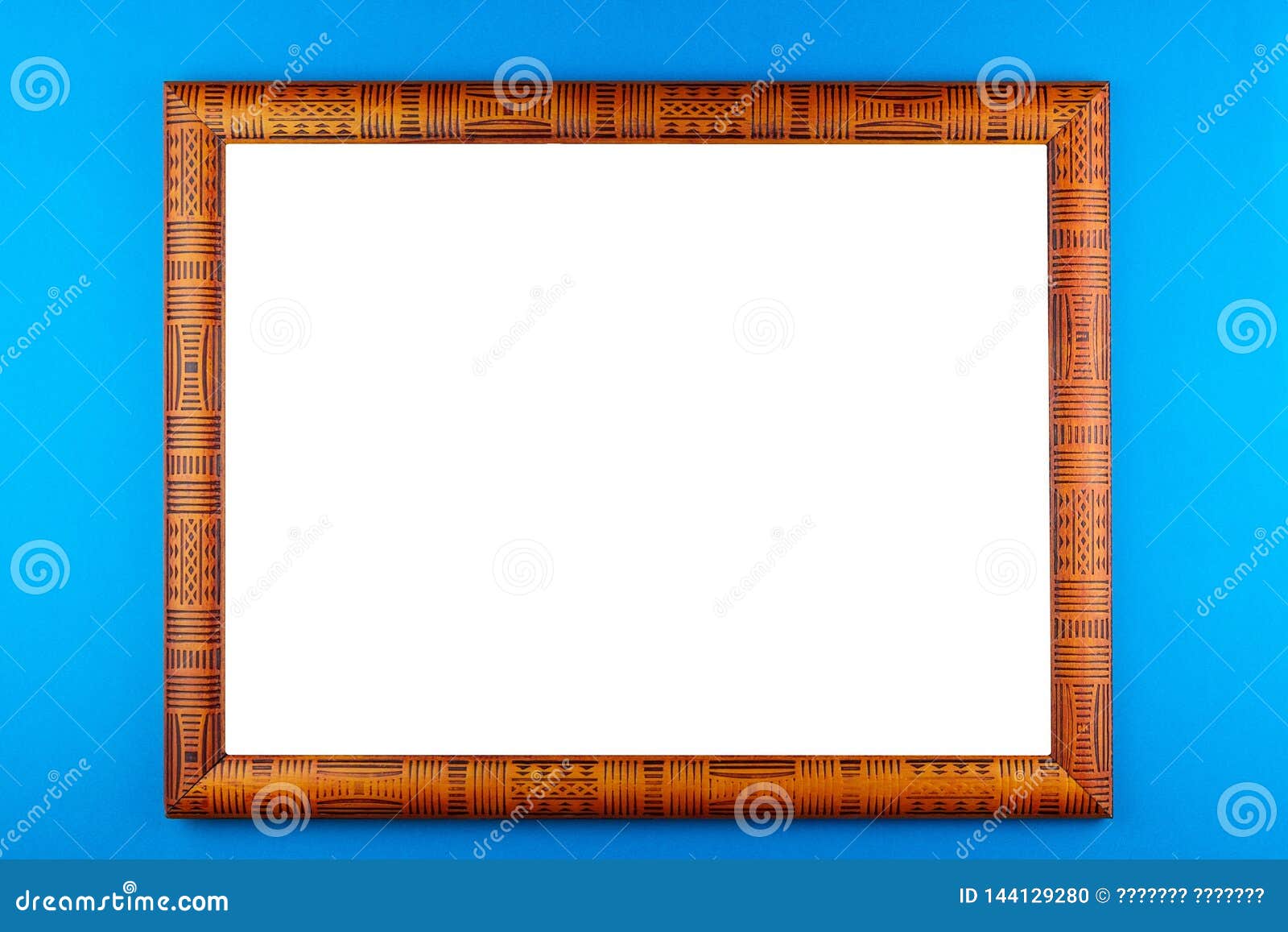 Wooden frame blue background. Wooden frame isolated on a blue background