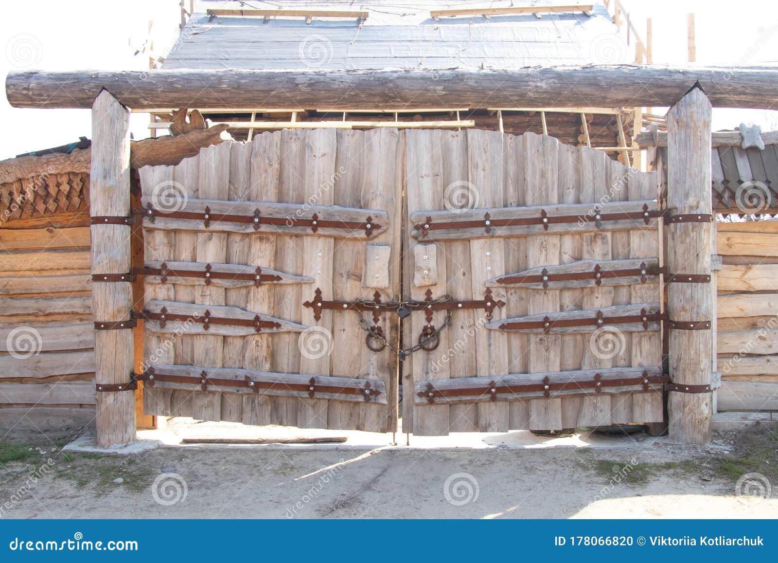Wooden Gate with an Iron Lock on a Sunny Day Stock Photo - Image of ...