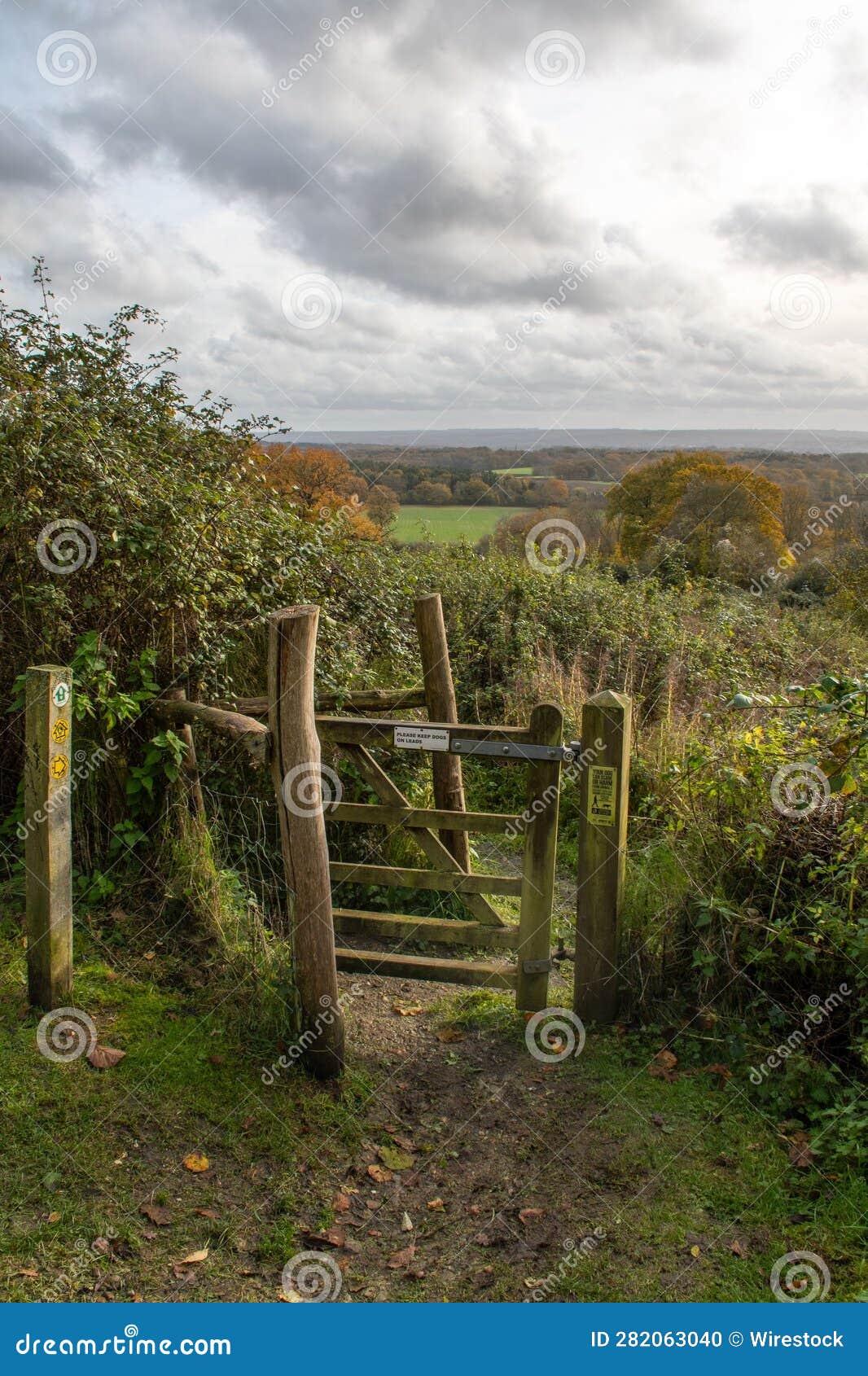 Wooden Gate with a Sign Please Keep Dogs on Leads. Stock Photo Image