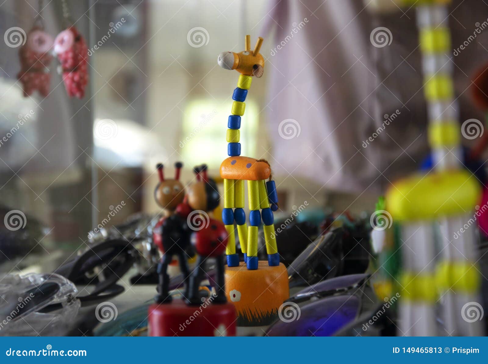 Wooden Giraffe Doll Decorated In A Glass Cabinet Displaying