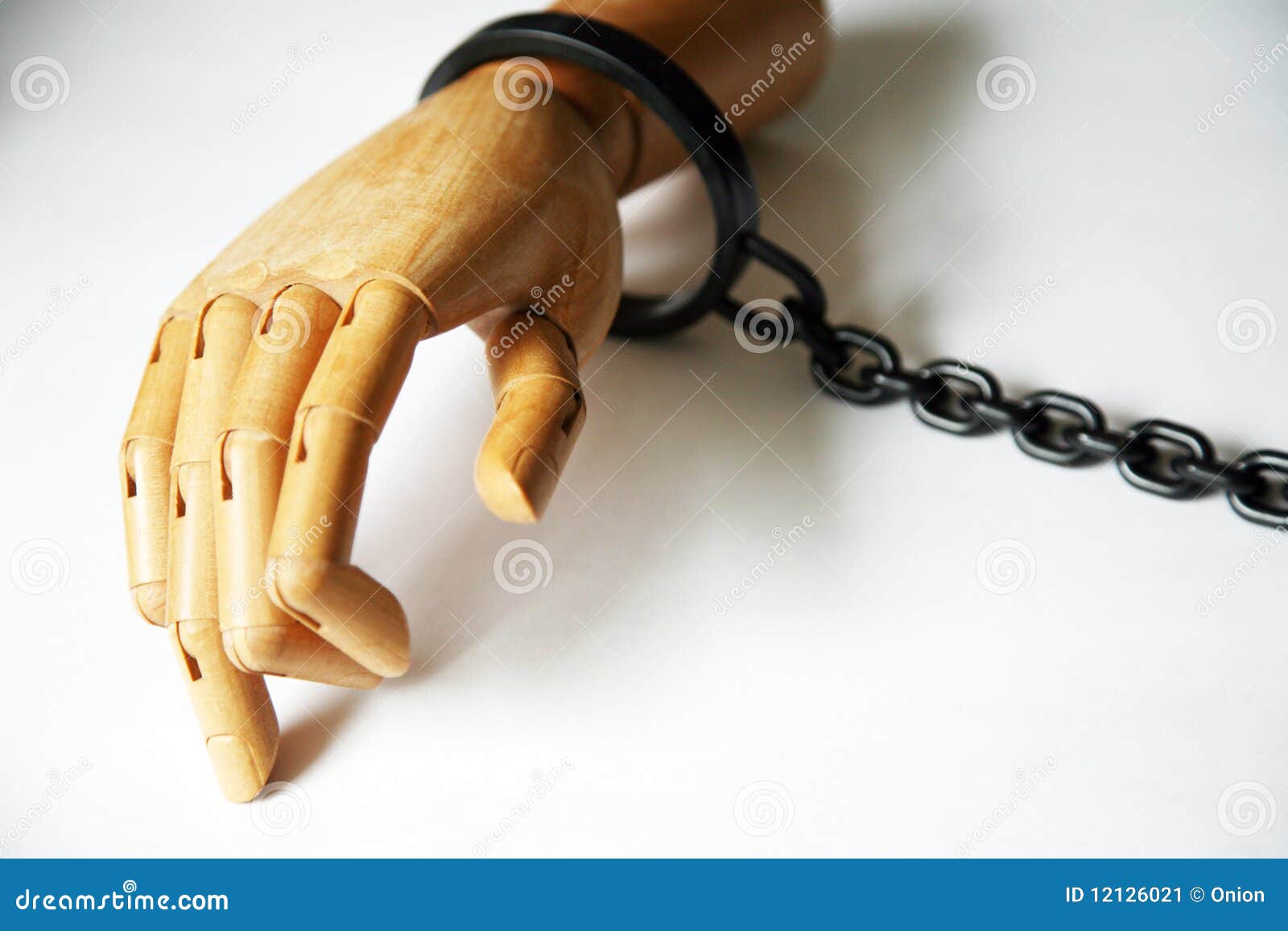 Wooden hand in handcuffs stock image. Image of slave 12126021