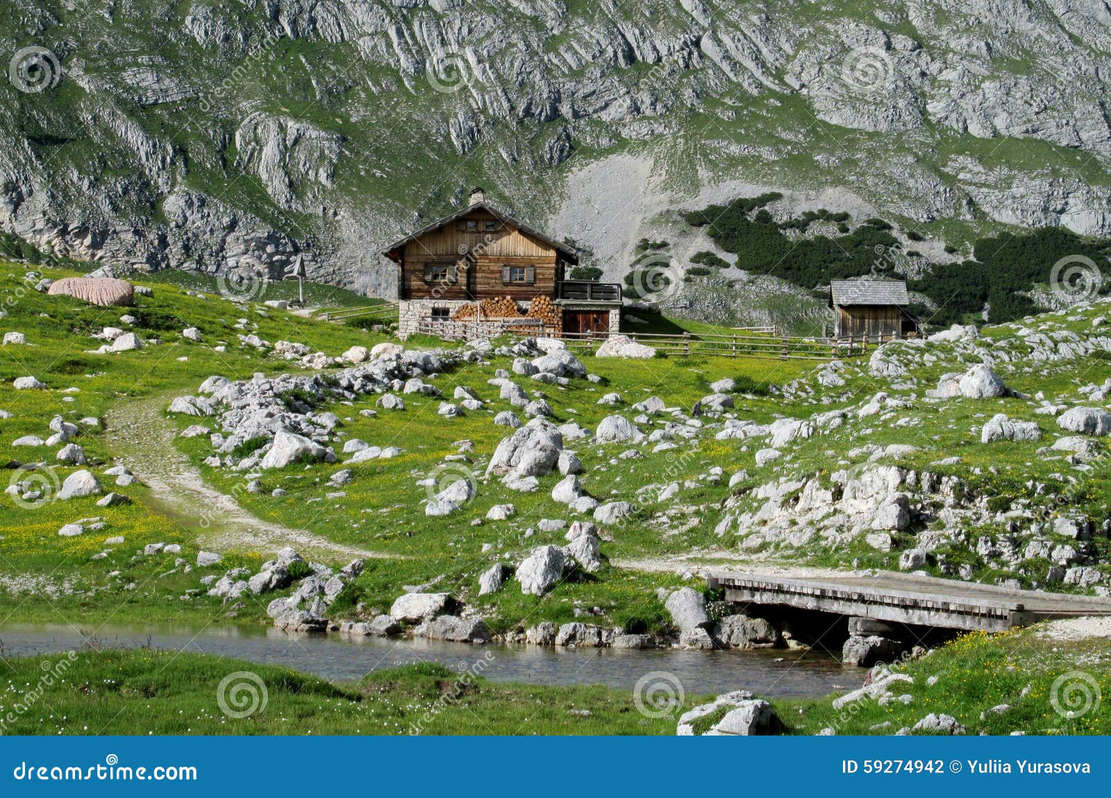 Wooden House In The Mountains Near River And Bridge Stock 