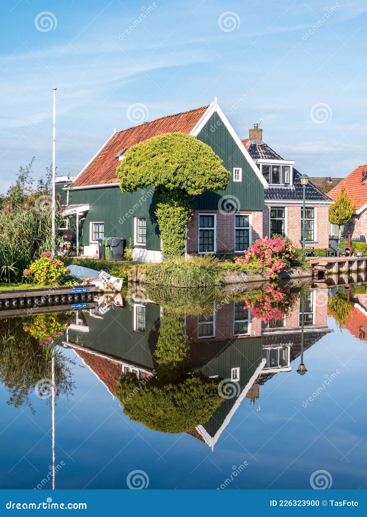 Wooden House Reflection in Canal in Warga, Leeuwarden, Friesland ...