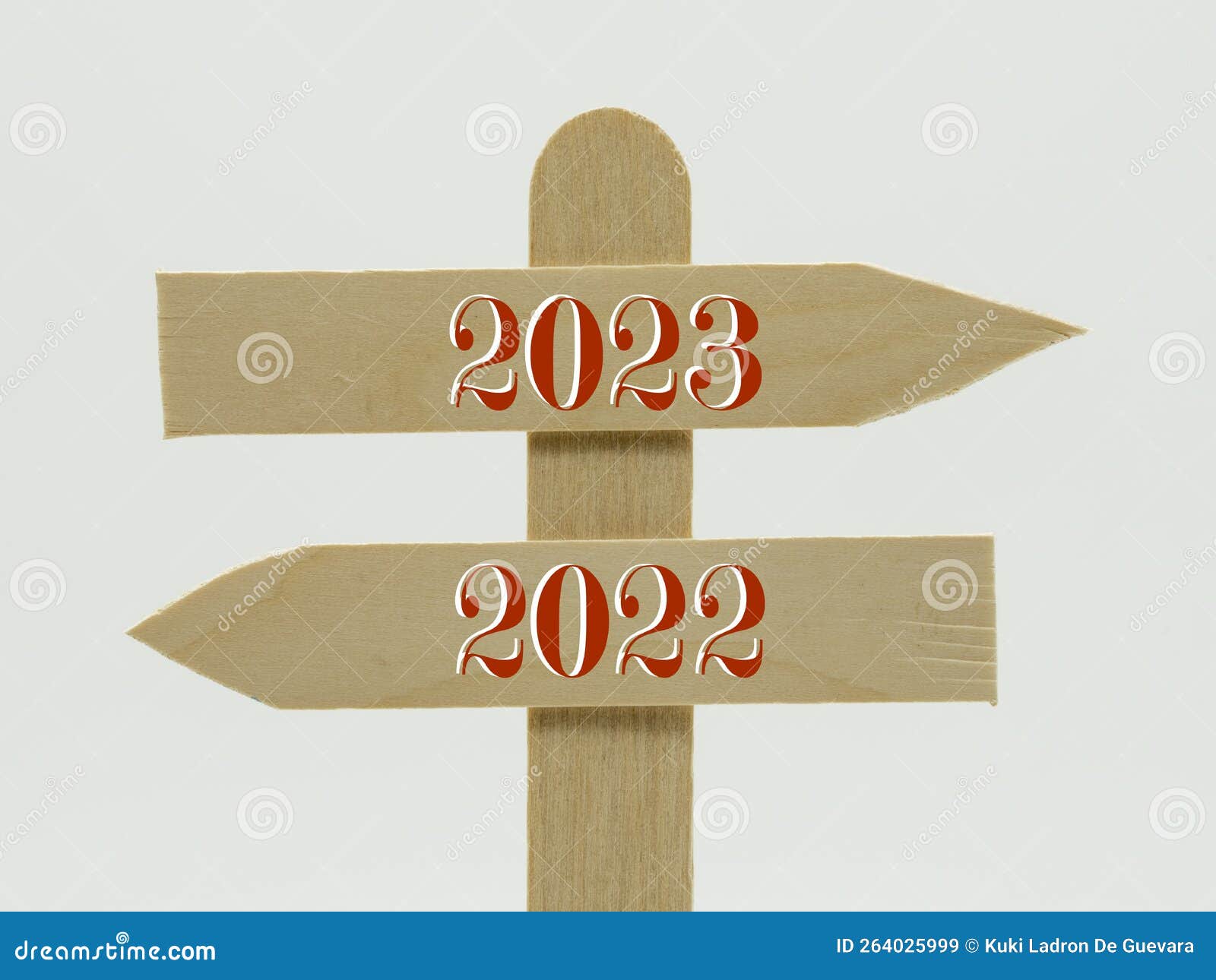 wooden indicator sign with the year 2023 and 2022