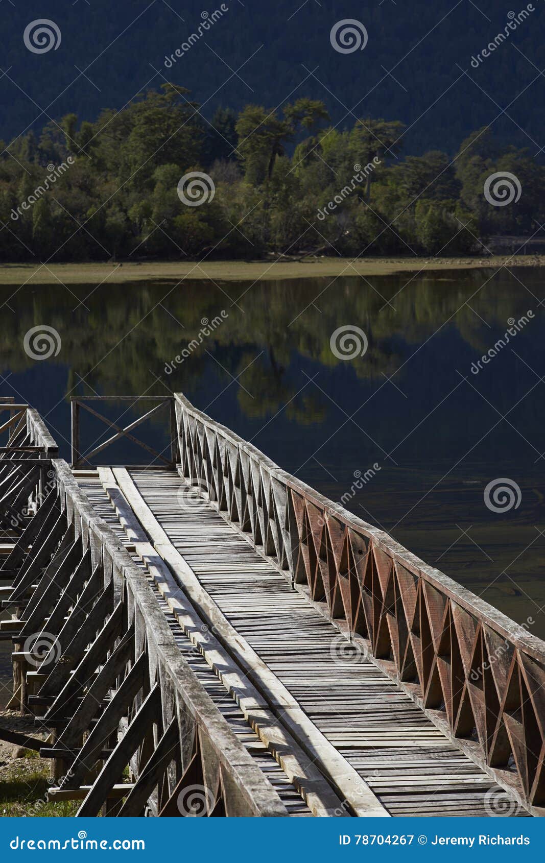 wooden jetty on lake rosselot in the aysen region of chile