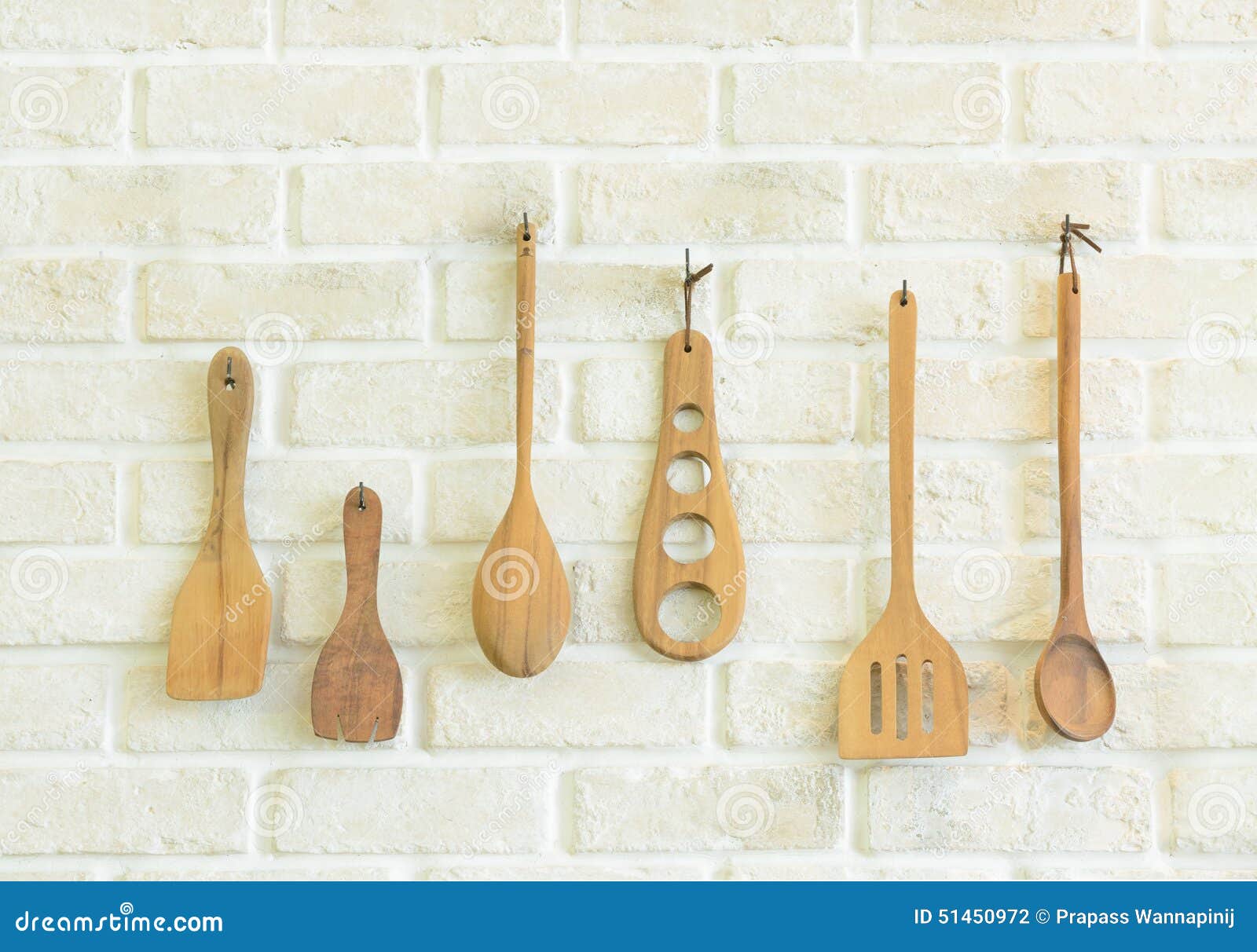 Wooden Kitchen Utensils On White Brick Wall Stock Photo Image