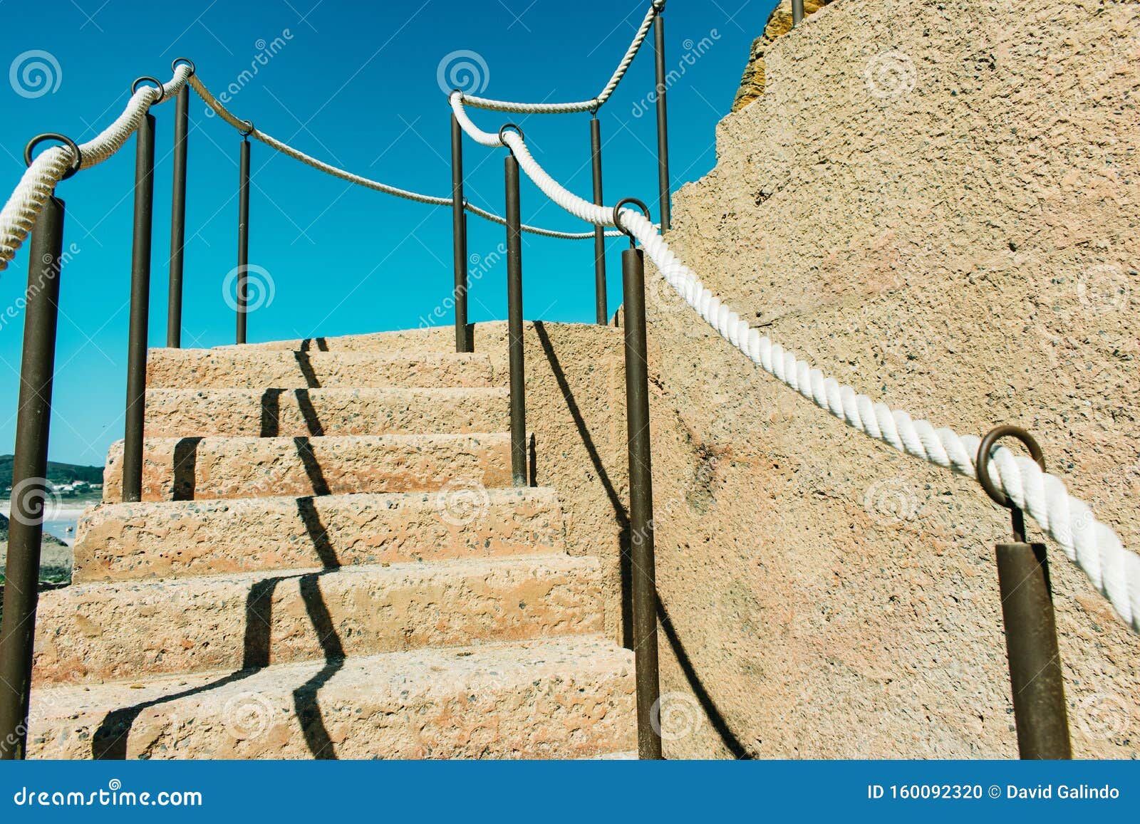 Wooden Ladder with Rope Railings on Cliff by the Ocean Stock Photo - Image  of success, cord: 160092320