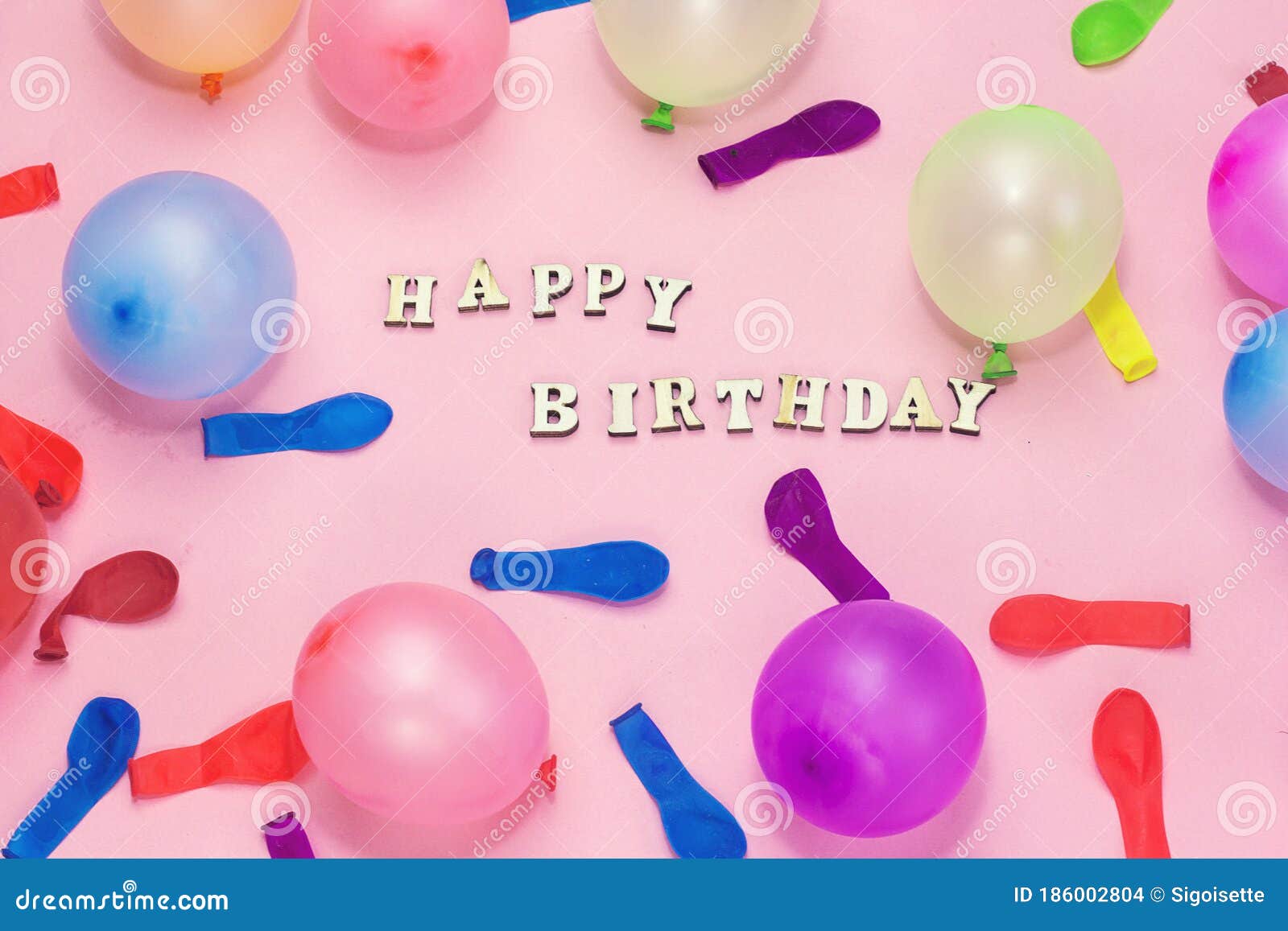 Wooden Letters Forming Happy Birthday and Colorful Ballons on Pink ...