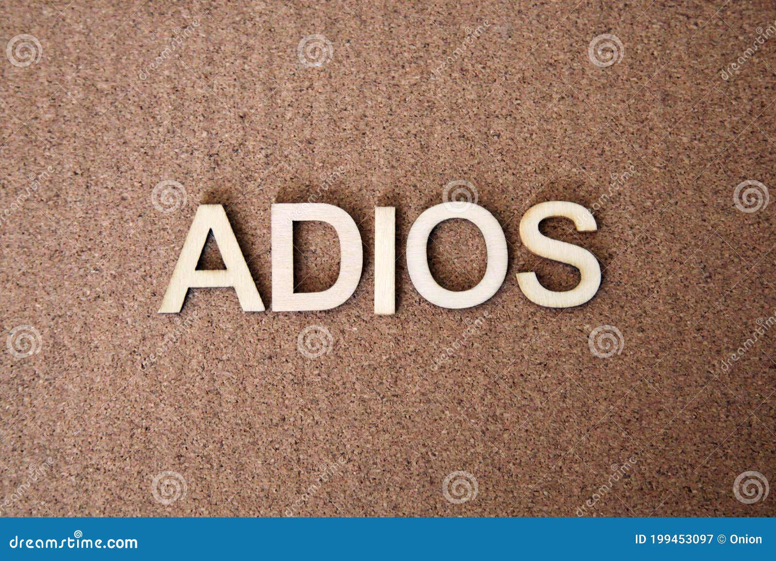 wooden letters forming the words adios in spanish