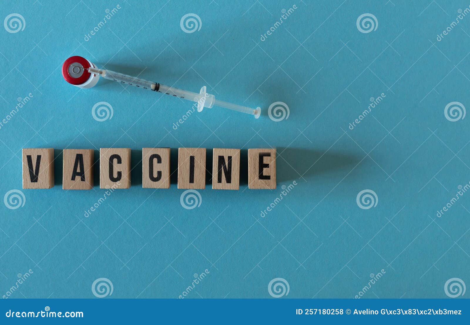 wooden letters vacuna with a viral and a syringe