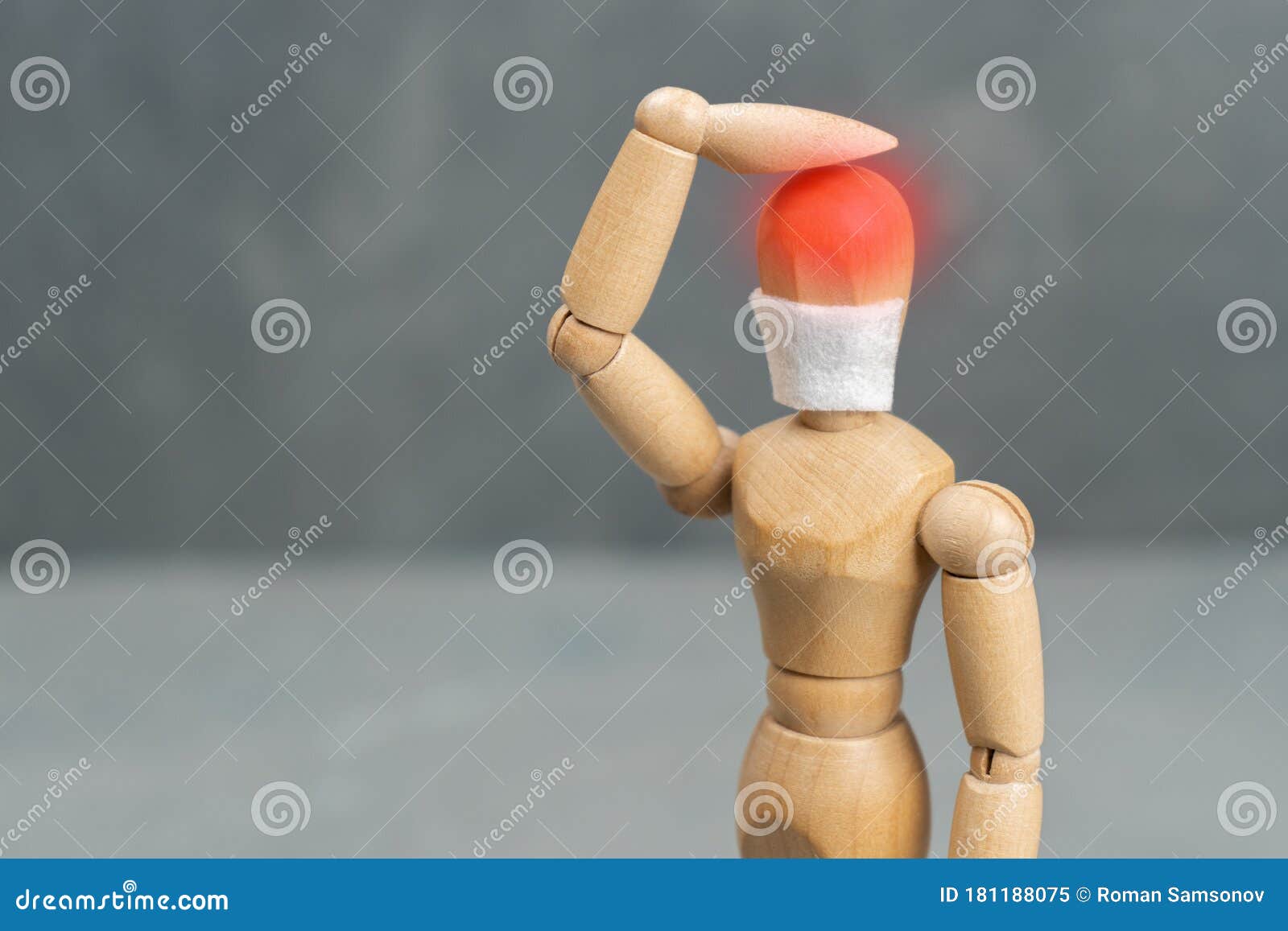 A Wooden Mannequin in a Medical Mask of Individual Protection is ...