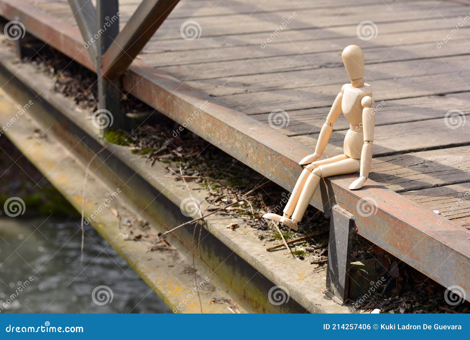 wooden mannequin sitting