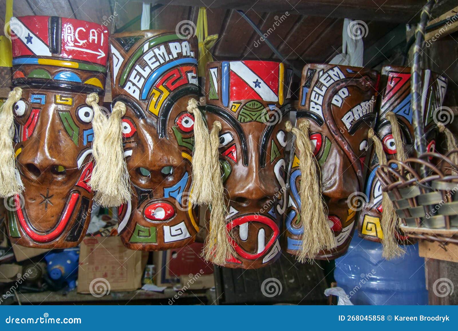 wooden masks of native amazonian people at a curio stall. location: mercado ver o peso, belem, state of para, amazon region,