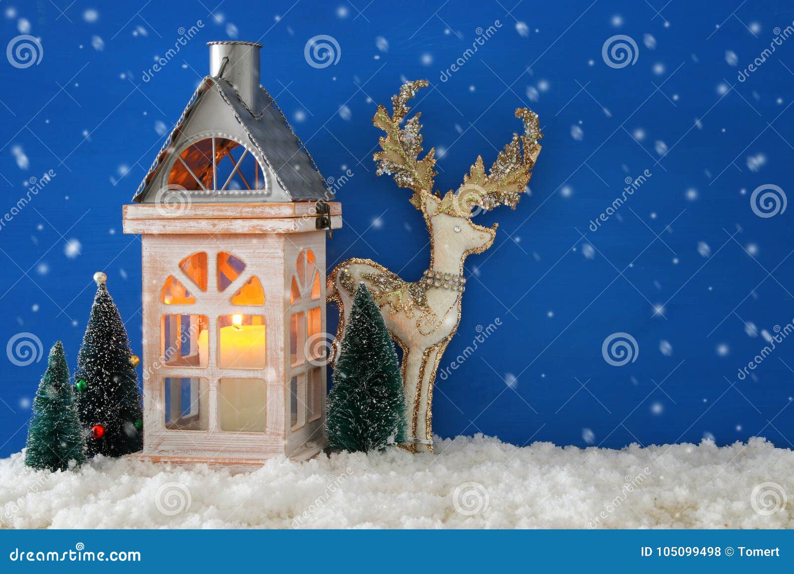 Wooden Old House with Candle, White Deer Next To Christmas Trees Over ...