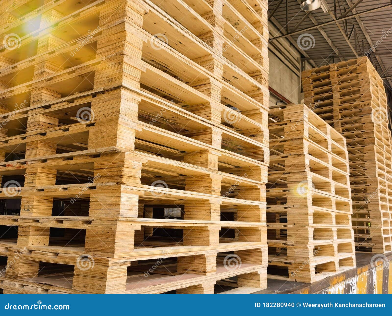 Wooden Pallets Stack at the Freight Cargo Warehouse for Transportation