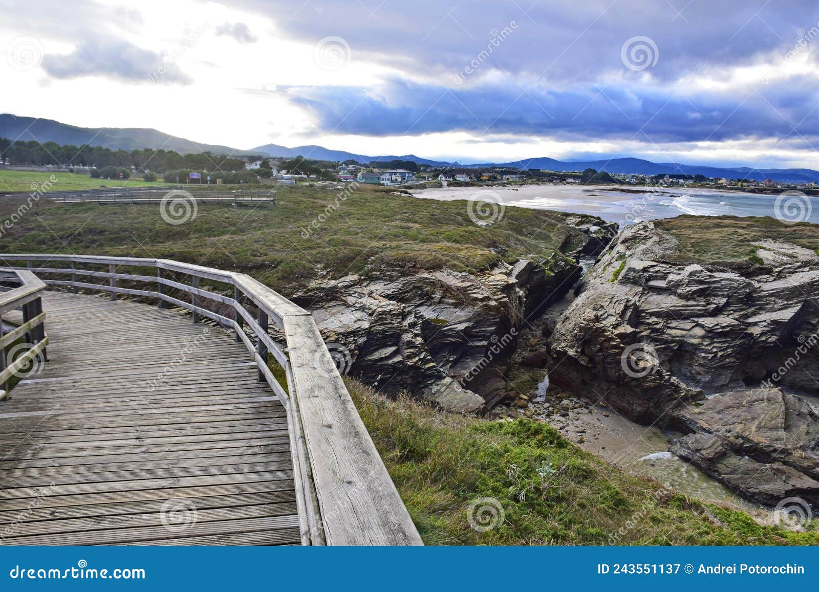 a wooden path along the cathedral beach. praia de augas santas, ribadeo