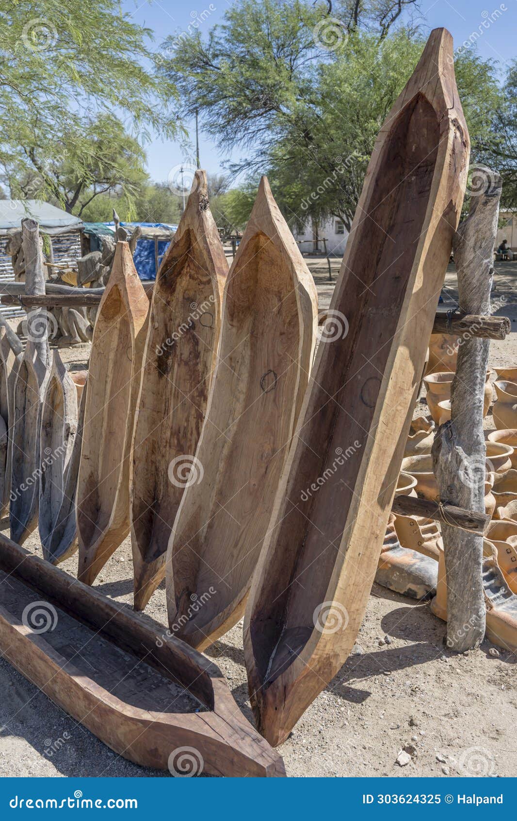 wooden pirogues at craft market, okahandja, namibia