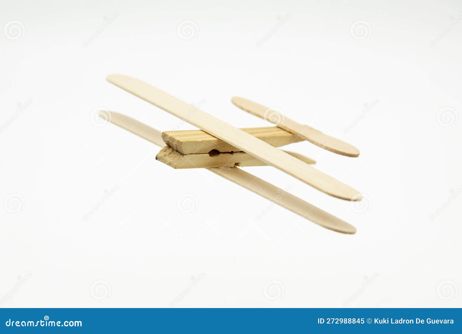 wooden plane made with ice cream sticks and a clothespin