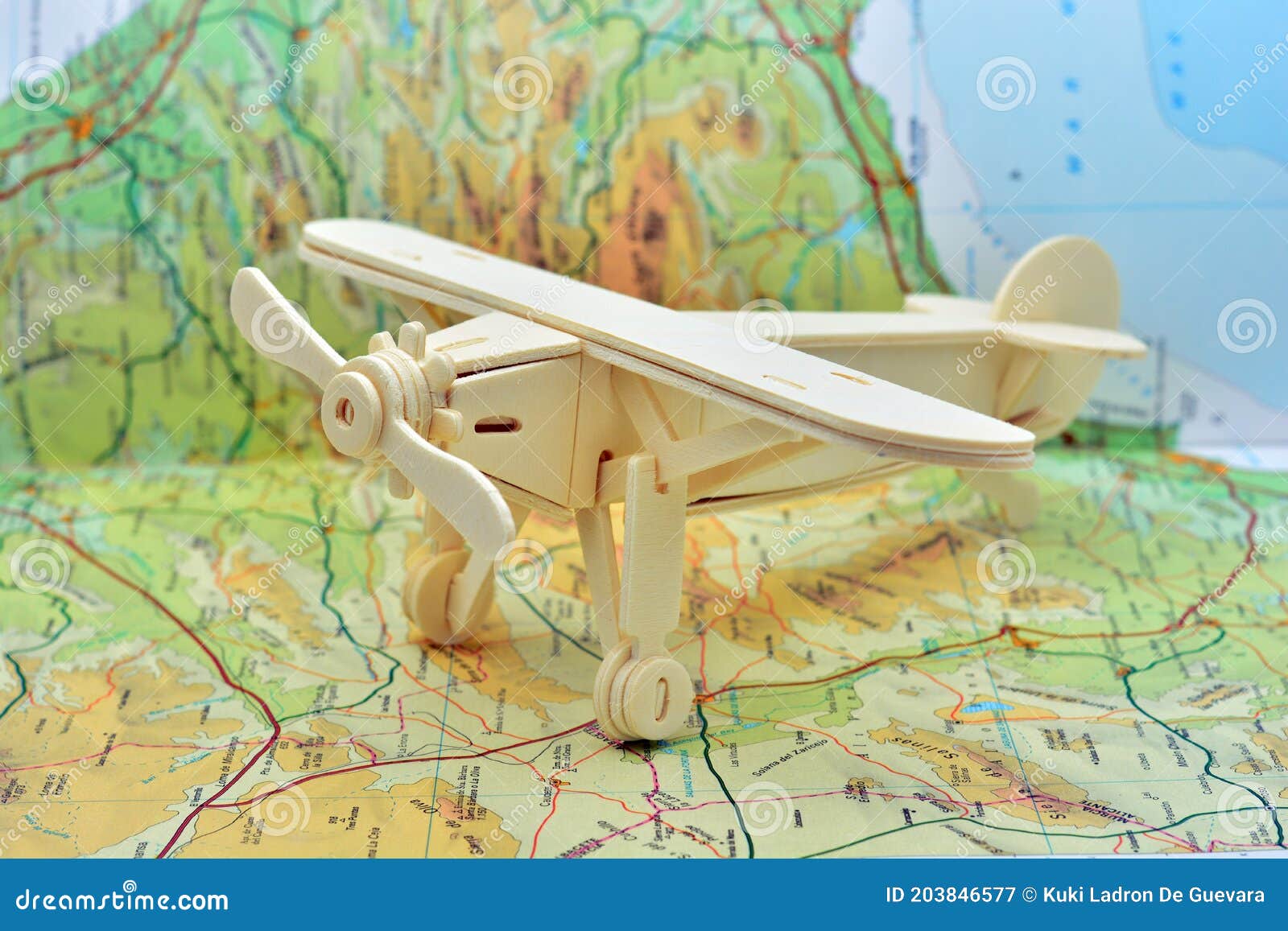 wooden plane on a map