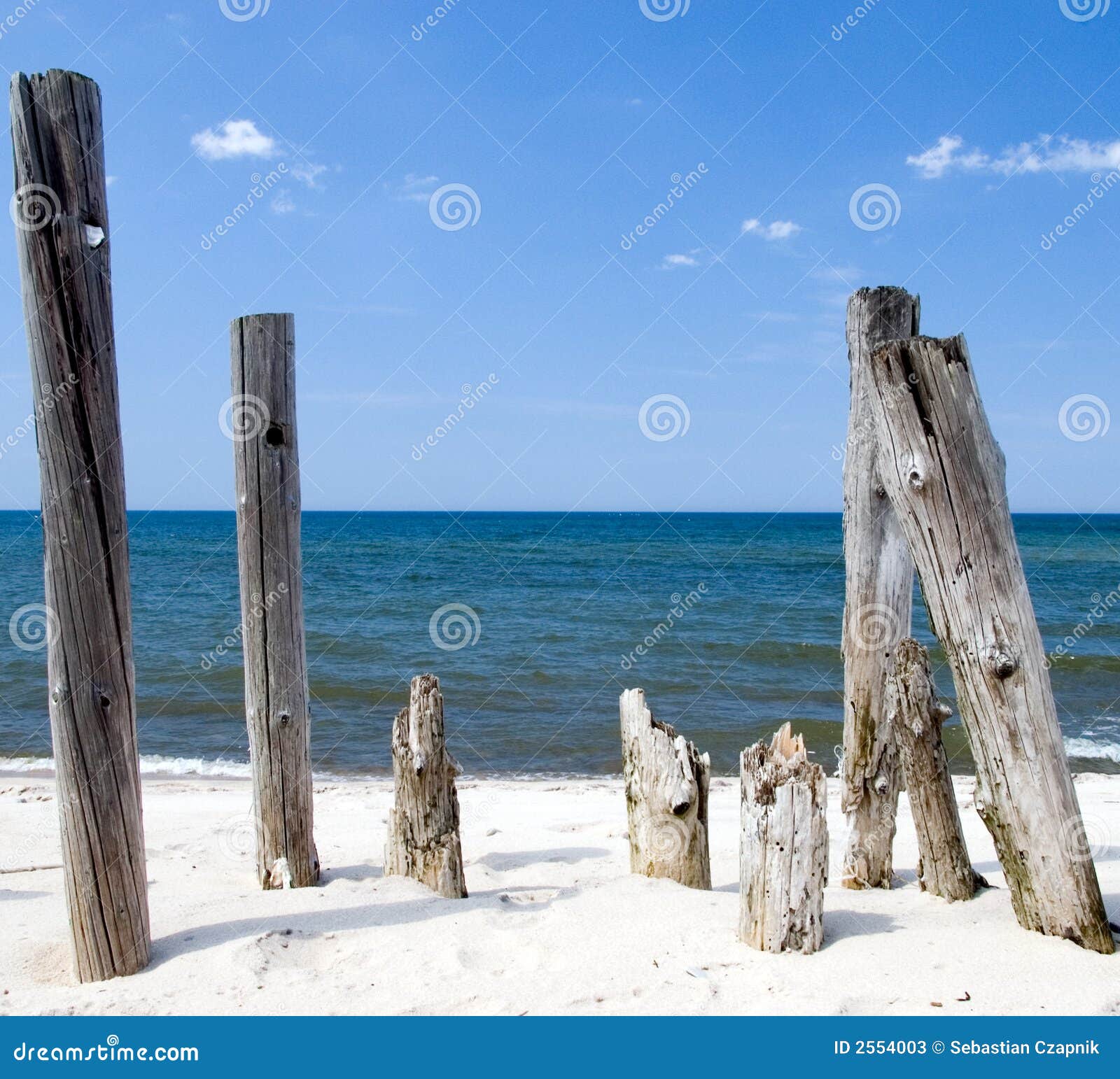 Wooden poles framing stock image. Image of wood, sand 2554003