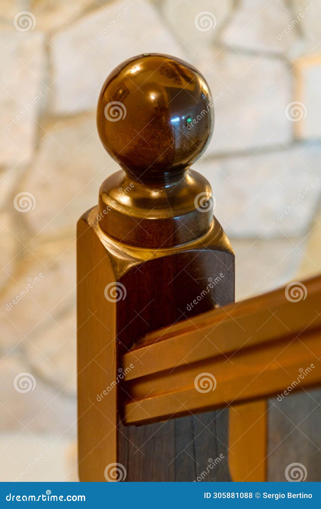 wooden post on the bannister of a stairwell