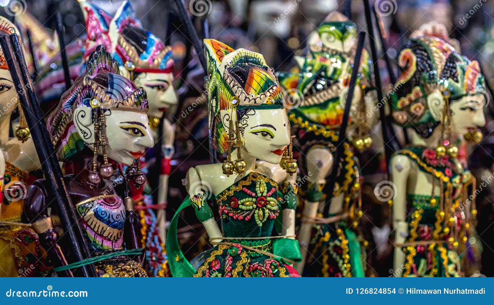 wooden puppet with traditional batik fabrique called `wayang golek` from java