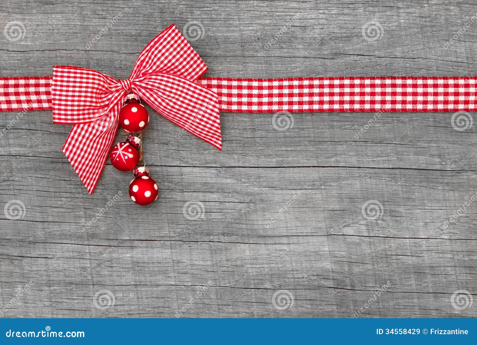 wooden red christmas background with a white checked ribbon