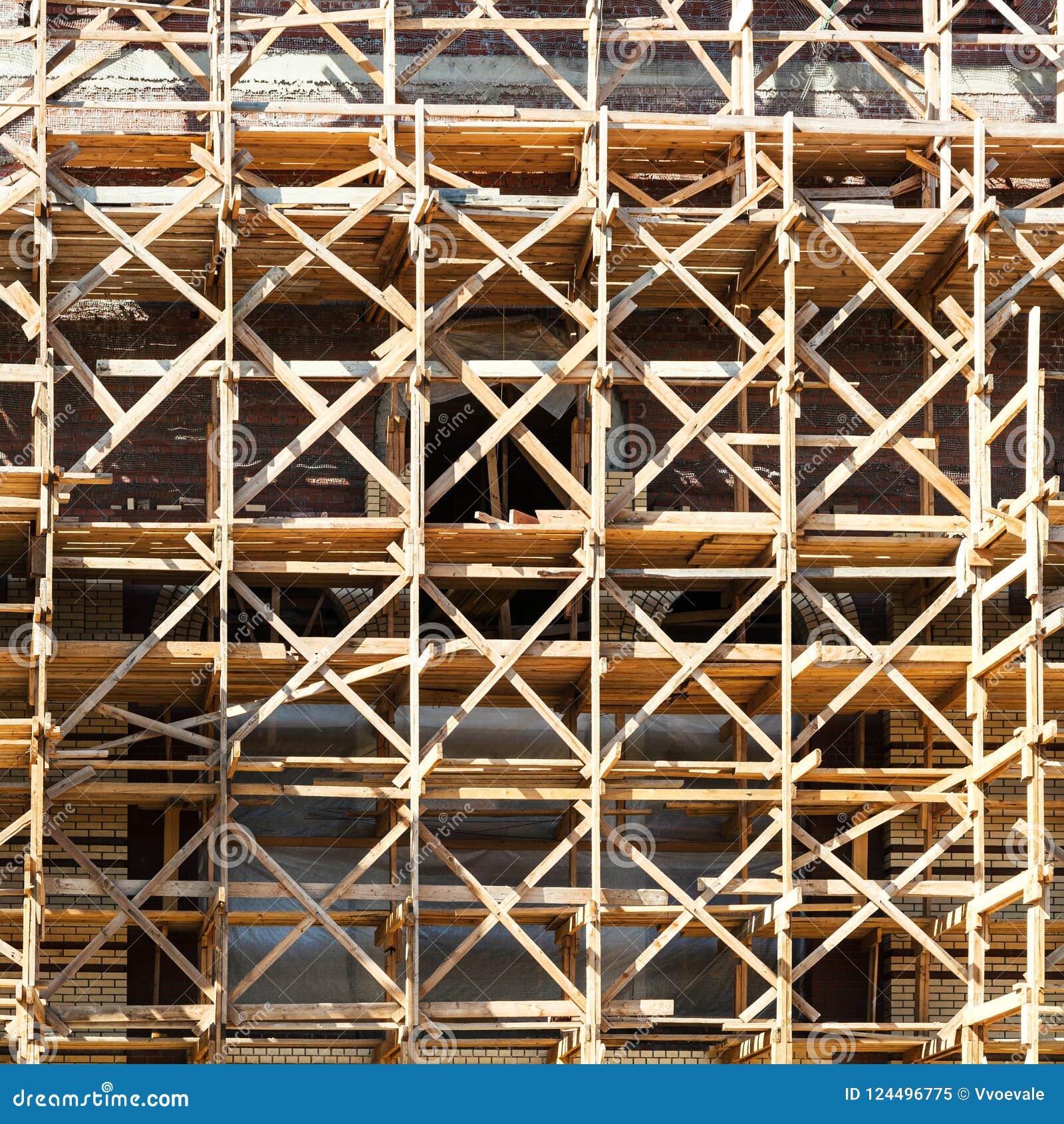 wooden scaffolding on multi-storey building