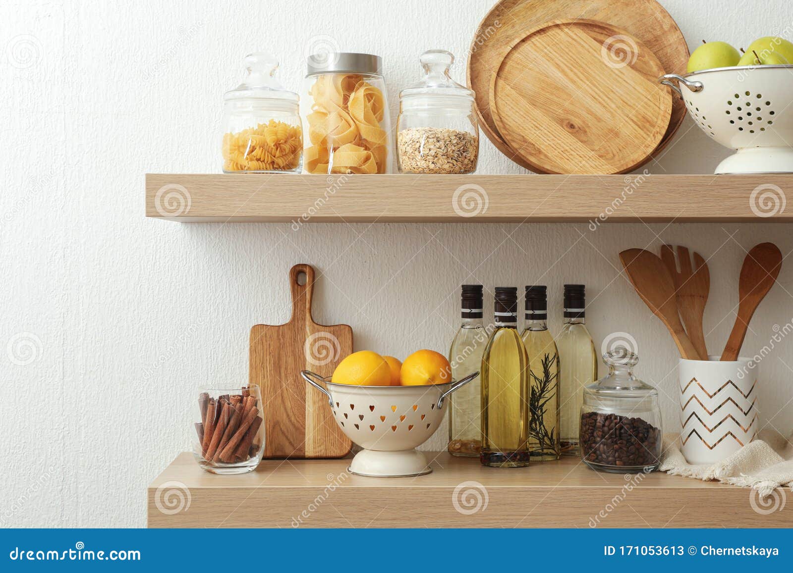 Wooden Shelves with Dishware and Products on Wall. Kitchen Interior ...