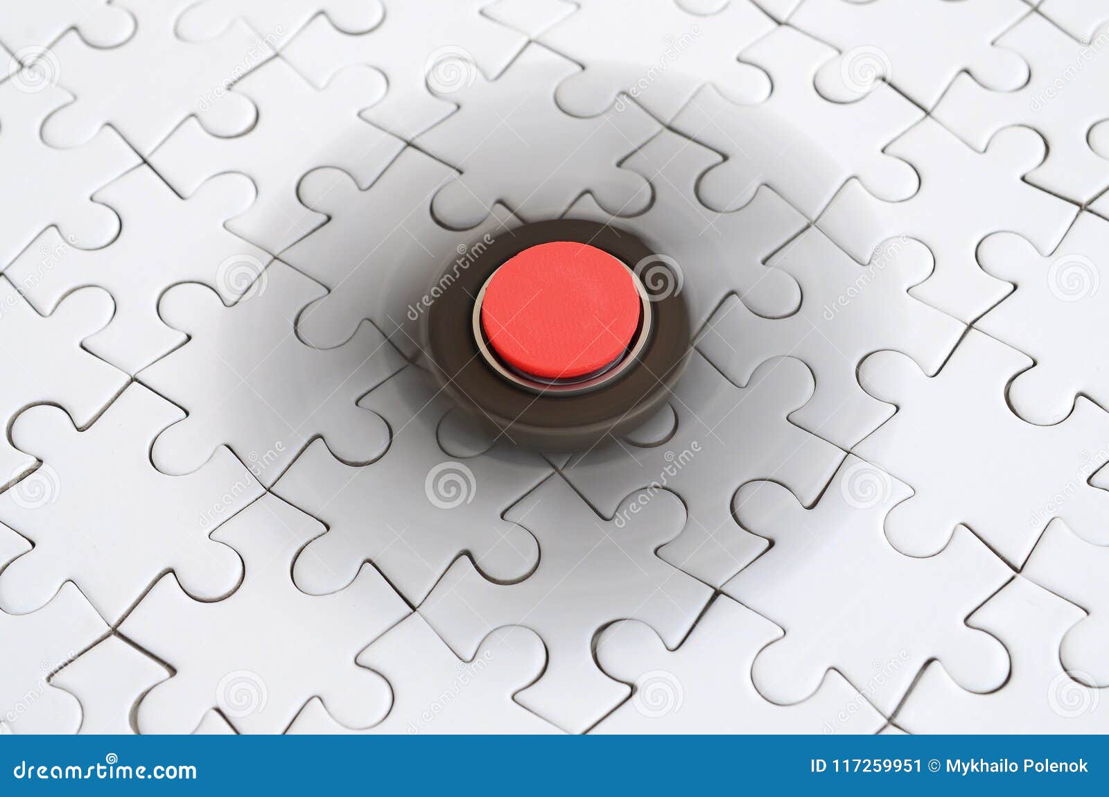 A Wooden Spinner Spins on a White Jigsaw Puzzle Background Stock Image