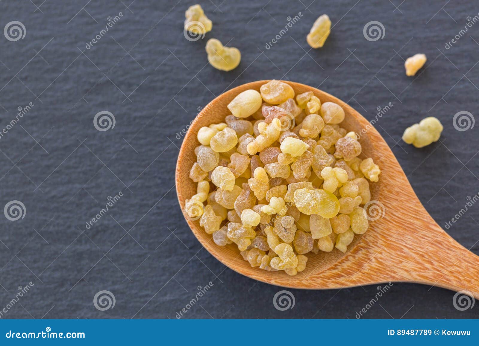 wooden spoon of aromatic yellow resin gum from sudanese frankincense tree, incense made of boswellia sacra tree