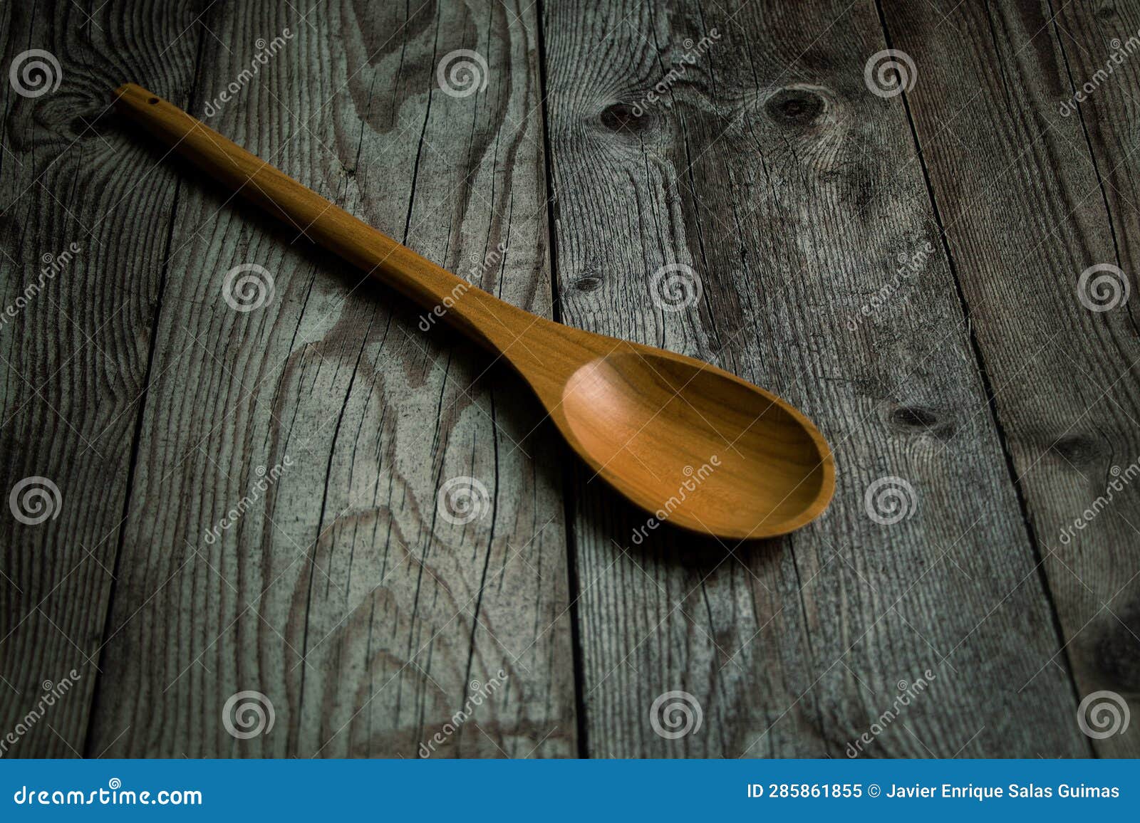 wooden spoon on a rustic table