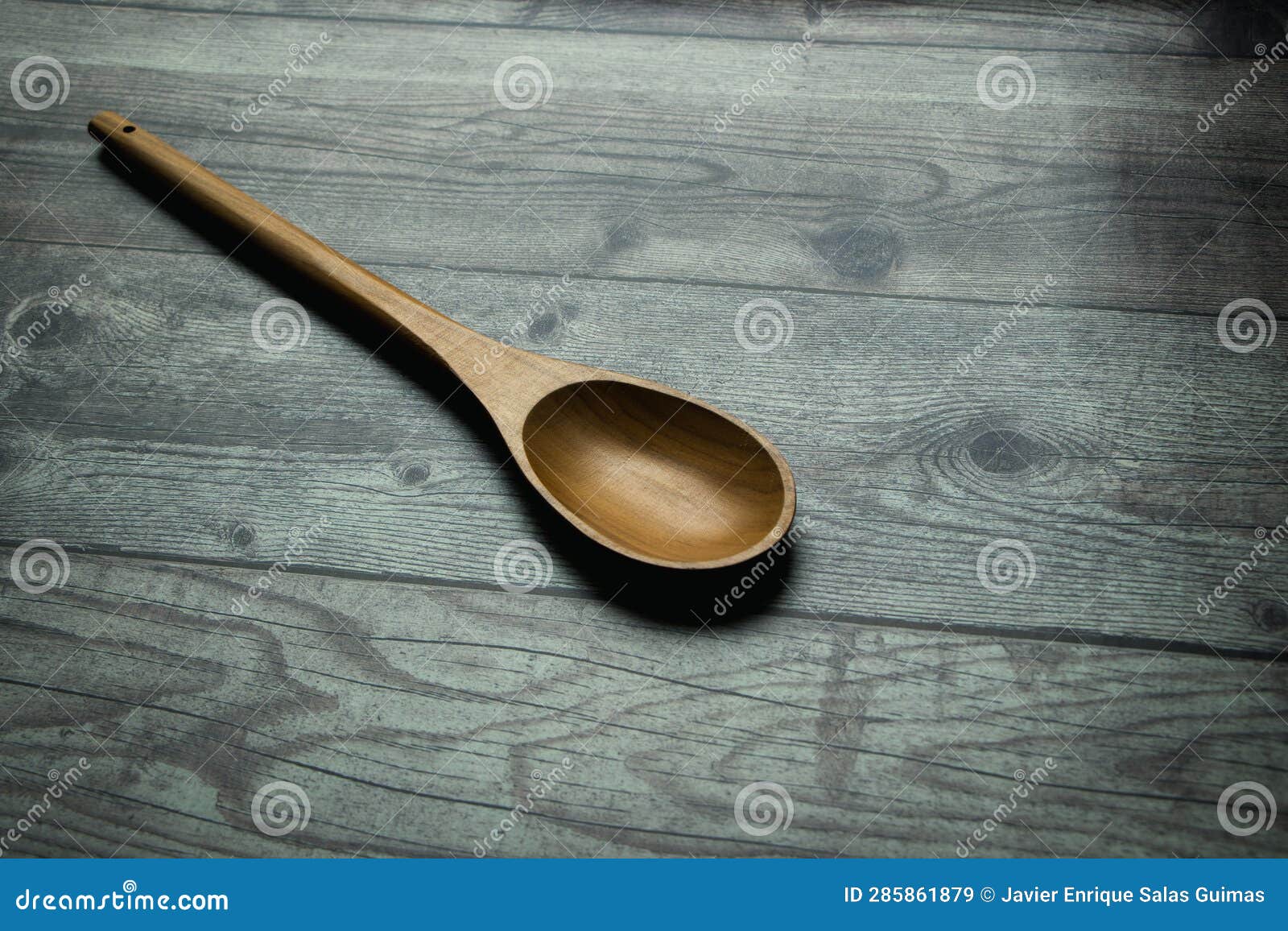 wooden spoon on a rustic table