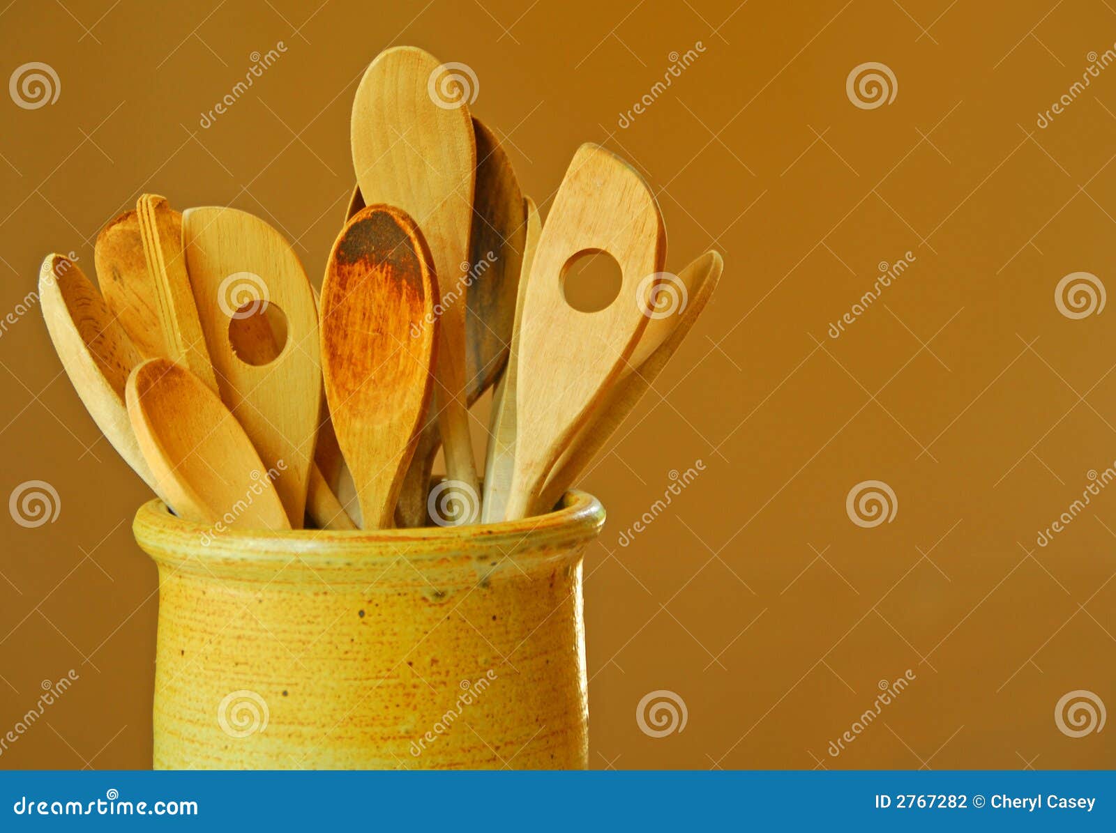 wooden spoons in crock