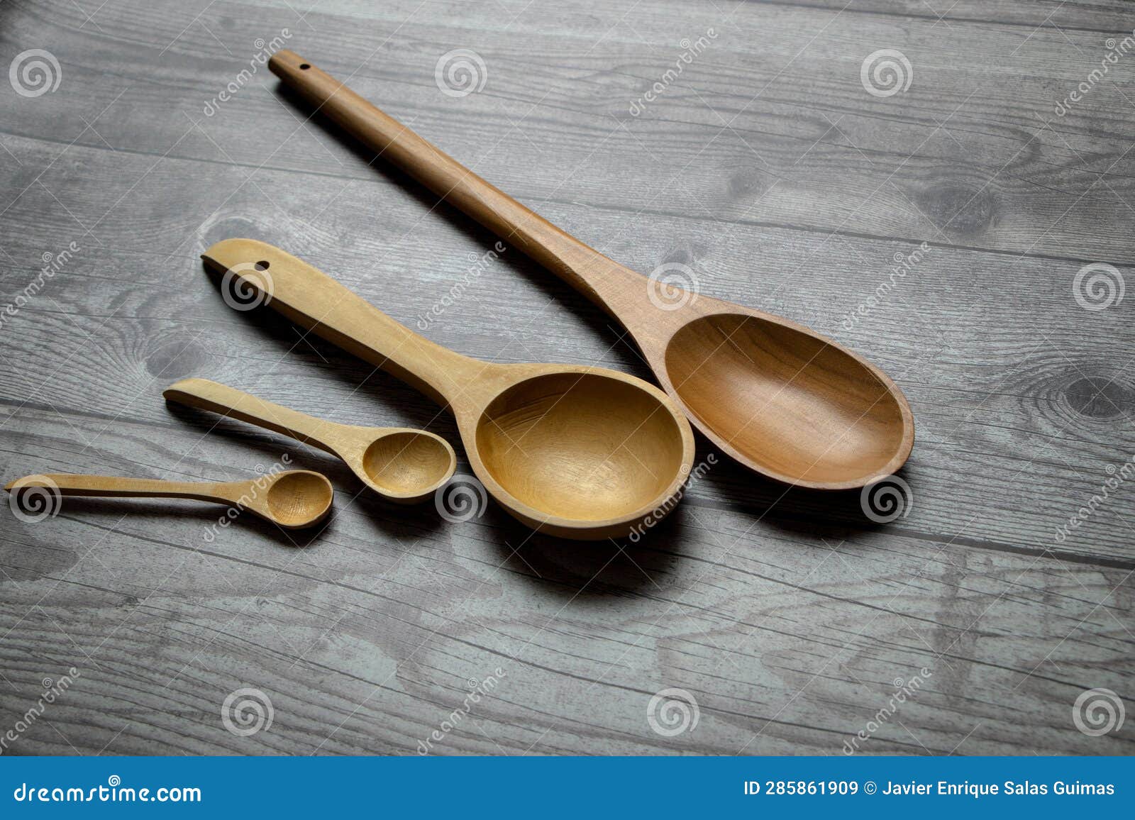 wooden spoons on a rustic table