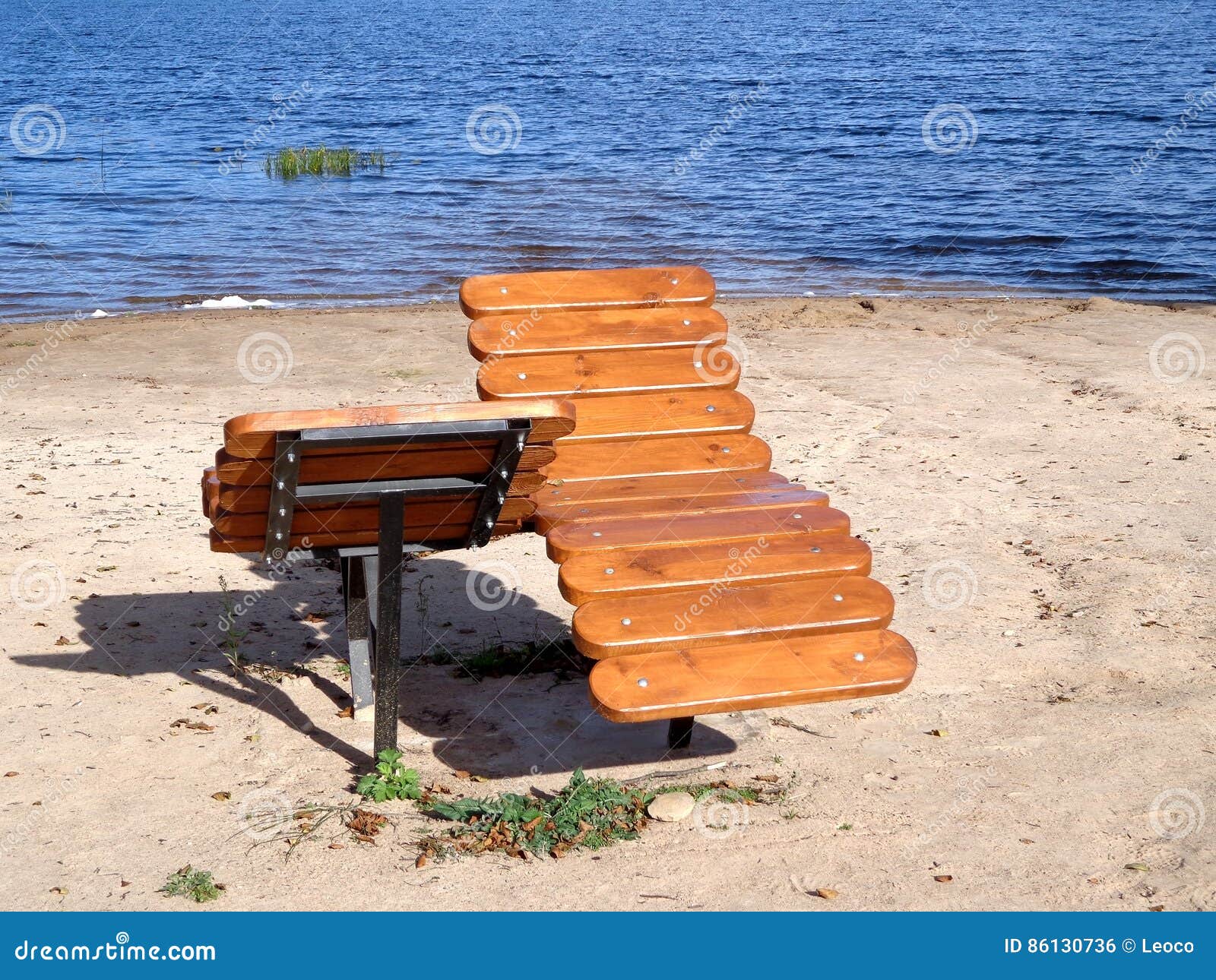 Wooden sunbeds stock photo. Image of ripple, water, surface 86130736