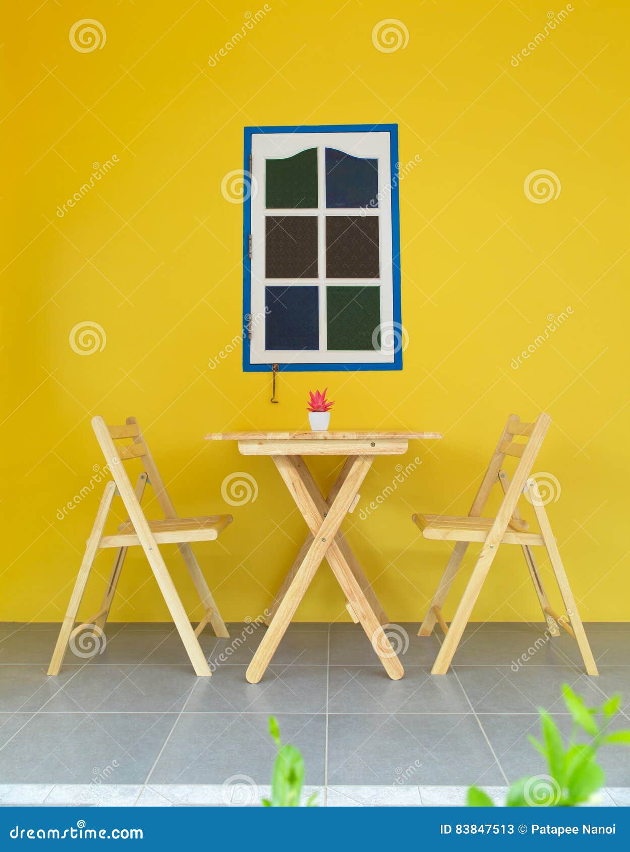 Wooden Table and Chairs with Yellow Wall Stock Image Image of chair