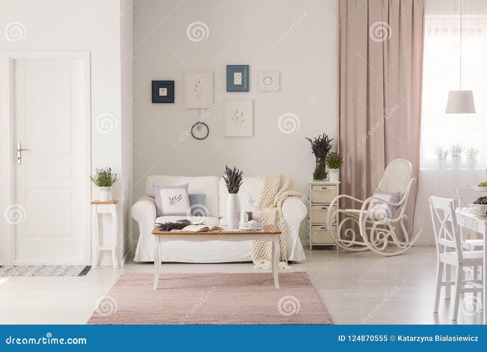 Wooden Table On Pink Rug In White Living Room Interior With