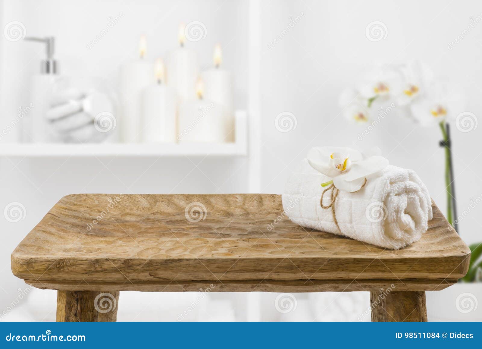 Wooden Table with Spa Towel on Blurred Bathroom Shelf Background Stock