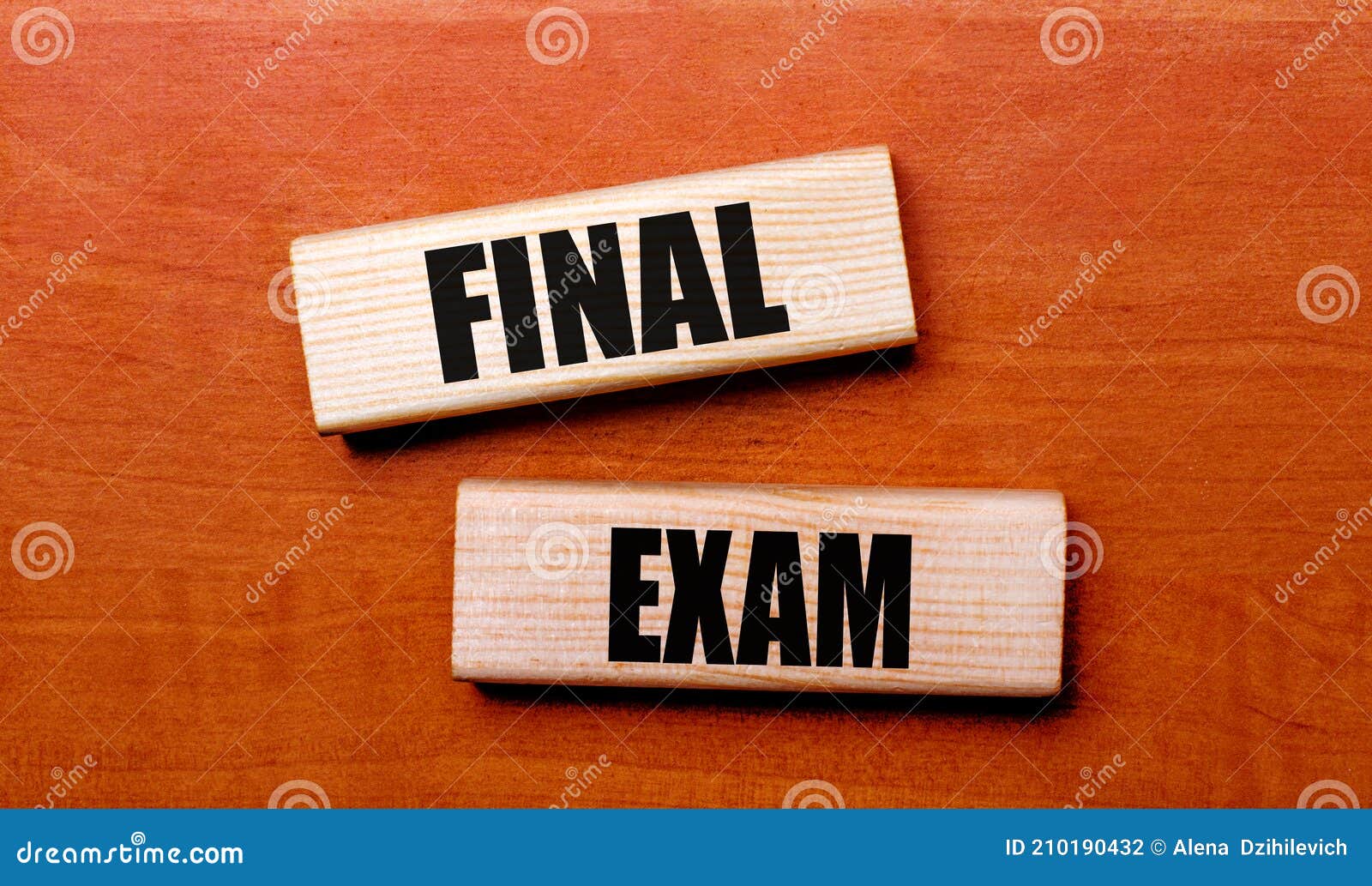 on a wooden table are two wooden blocks with the text final exam