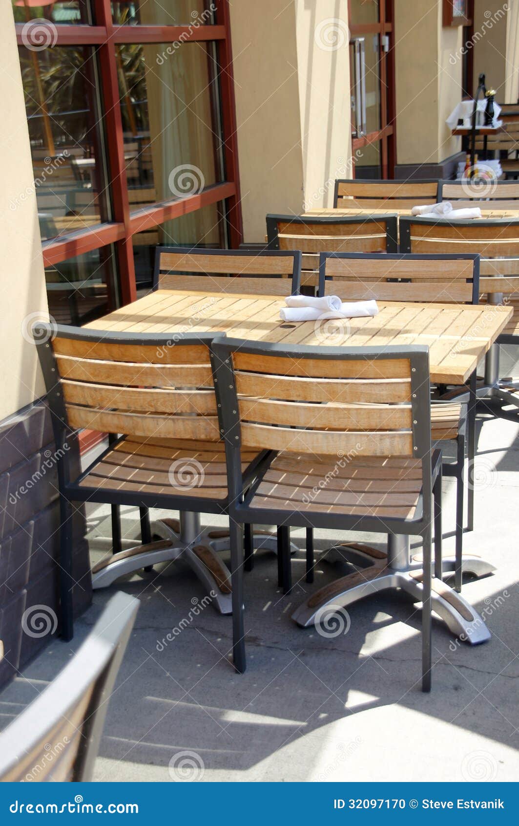 Wooden Tables And Chairs In Outdoor Restaurant Stock Photo