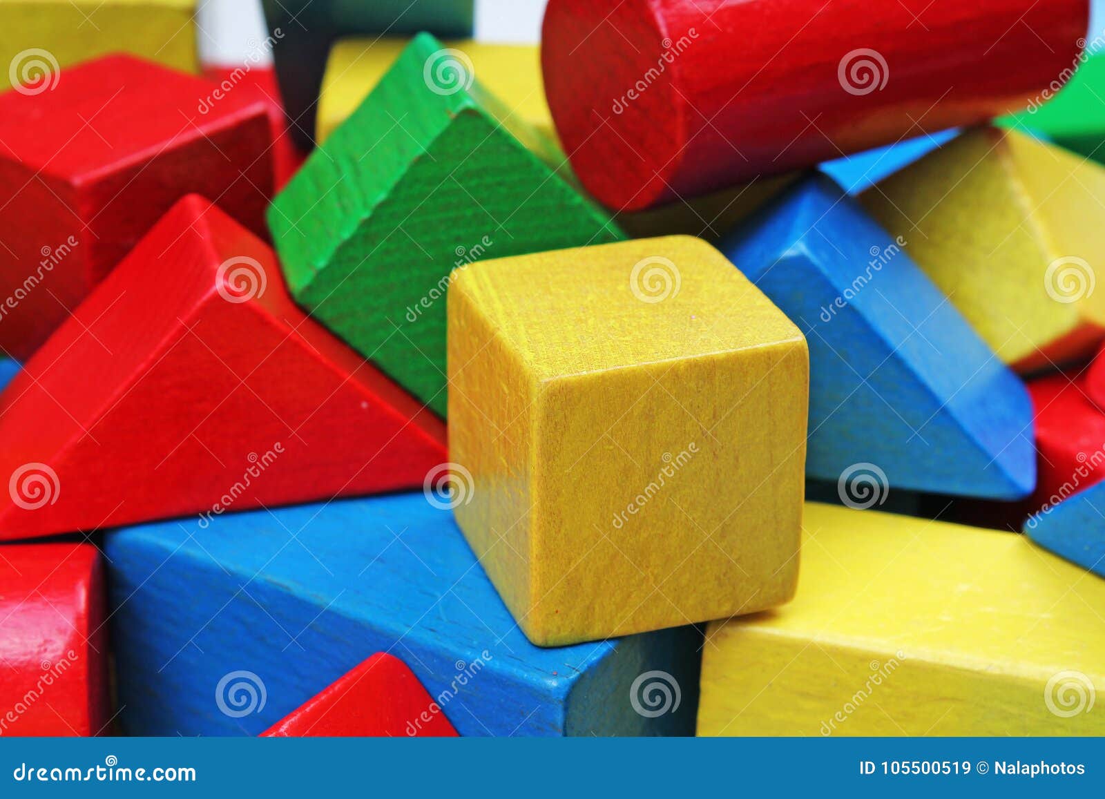 Wooden toy blocks background. Red, Blue, Yellow Green Wooden toy blocks on white background. Wood block texture pattern. Education.