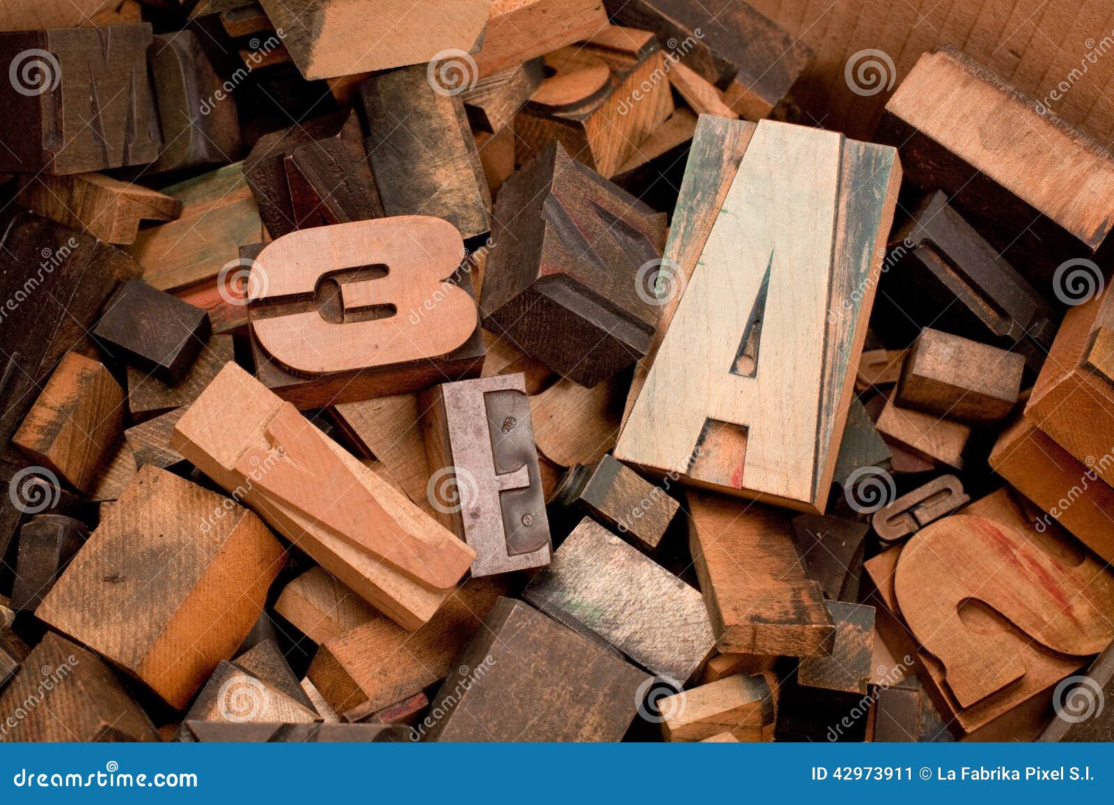 wooden typescript letters inside a box