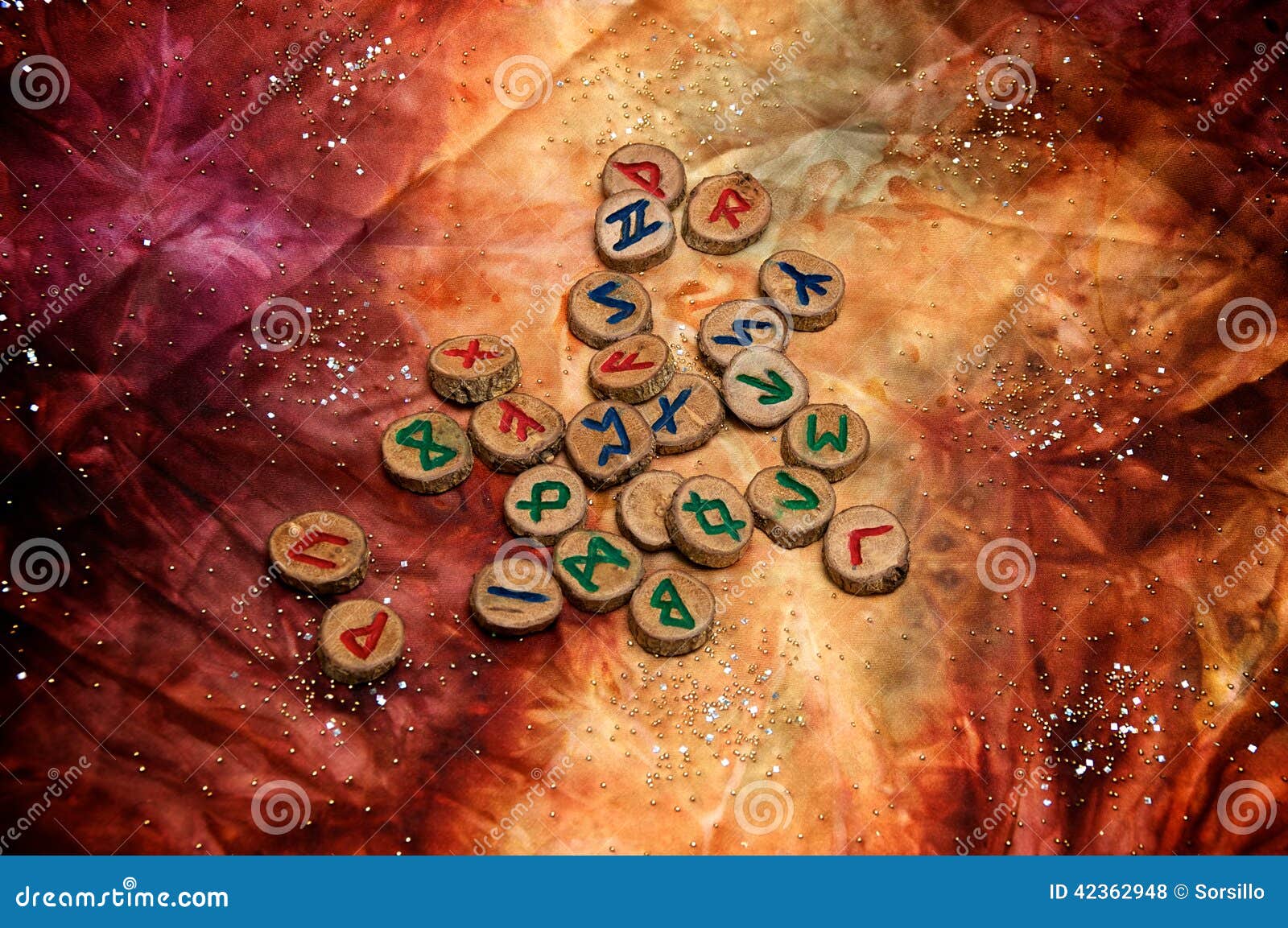 wooden viking runes on colorful mystical cloth